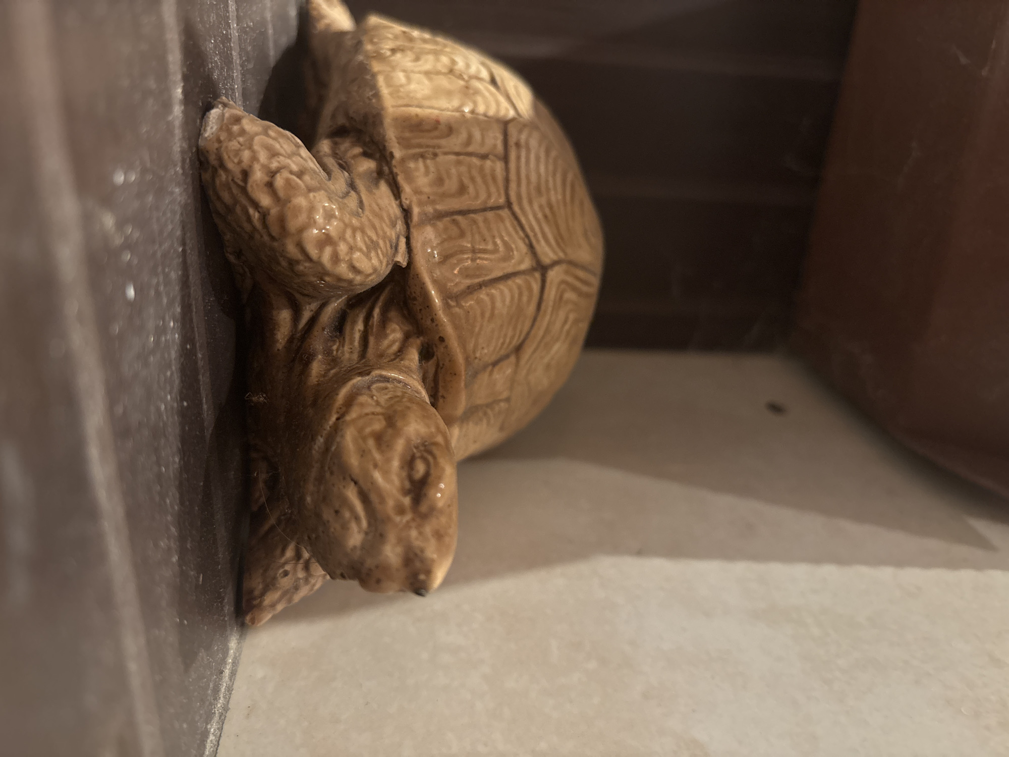 Decorative animal figurines observed in indoor Lom setting