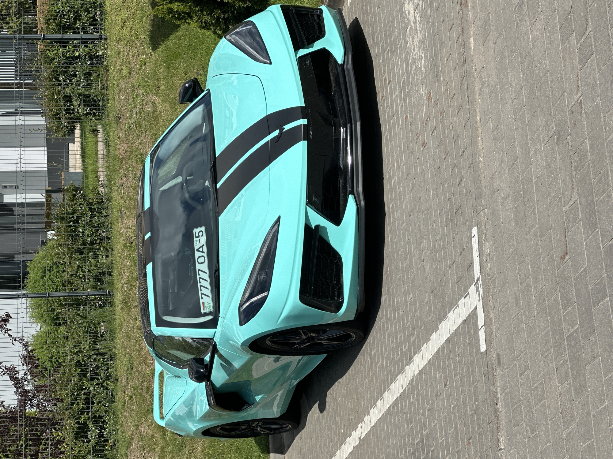 Teal Corvette C8 spotted parked in rural Belarus