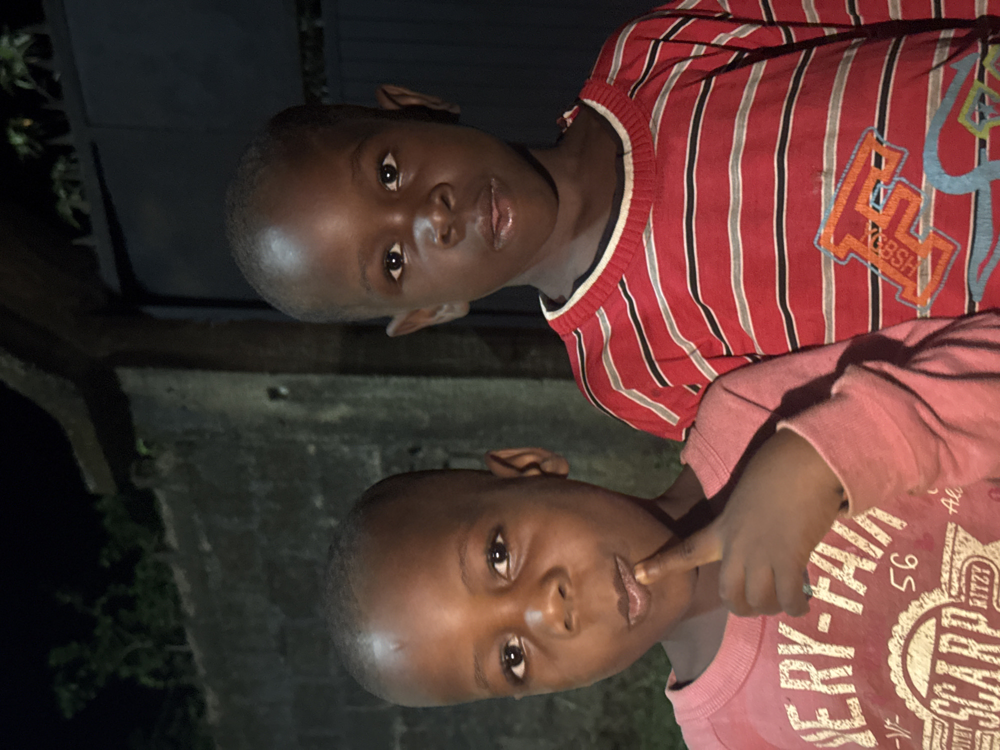 Two boys photographed in close-up in Eziudo, Nigeria