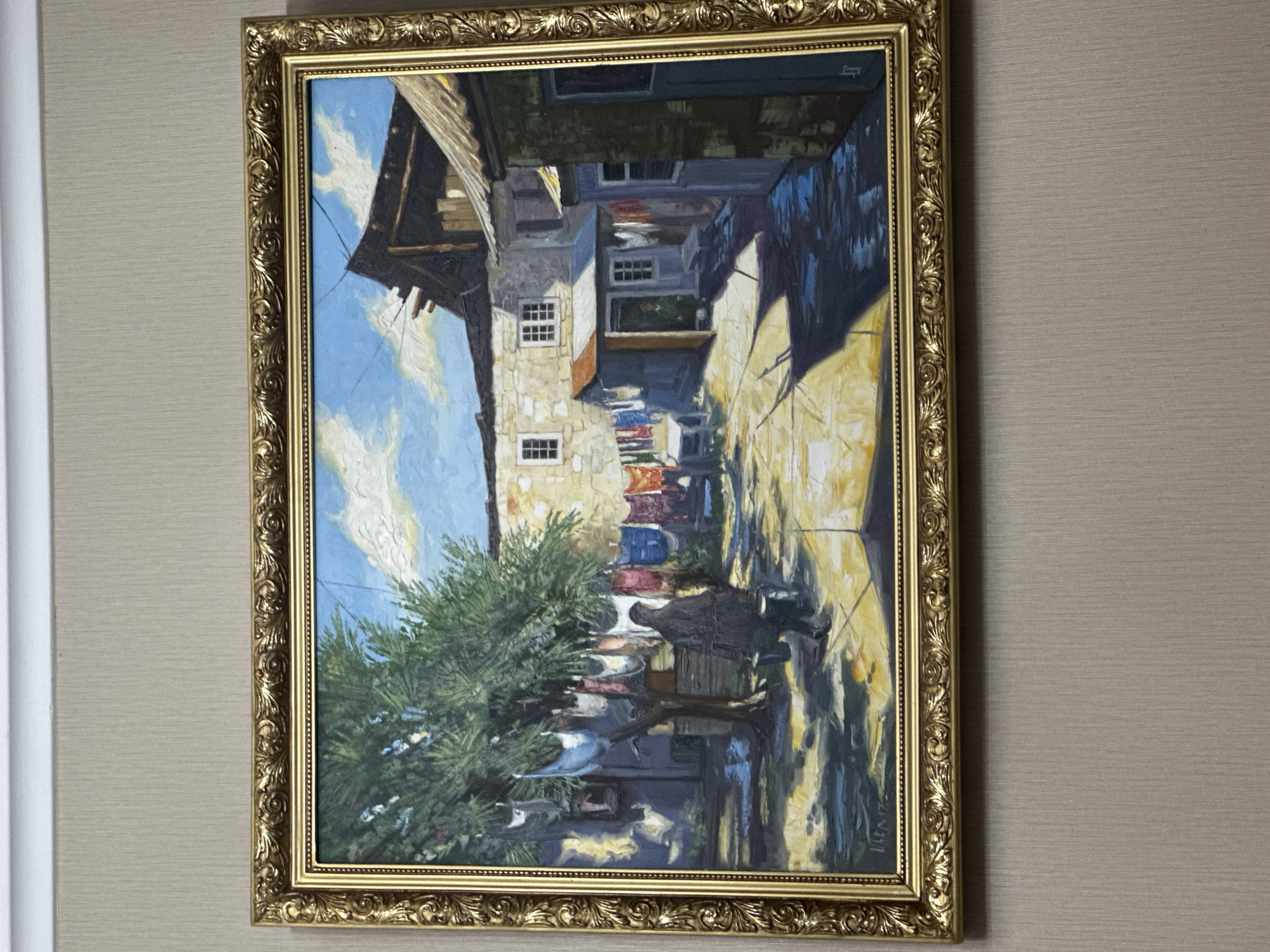 Framed alleyway painting observed on wall by witness