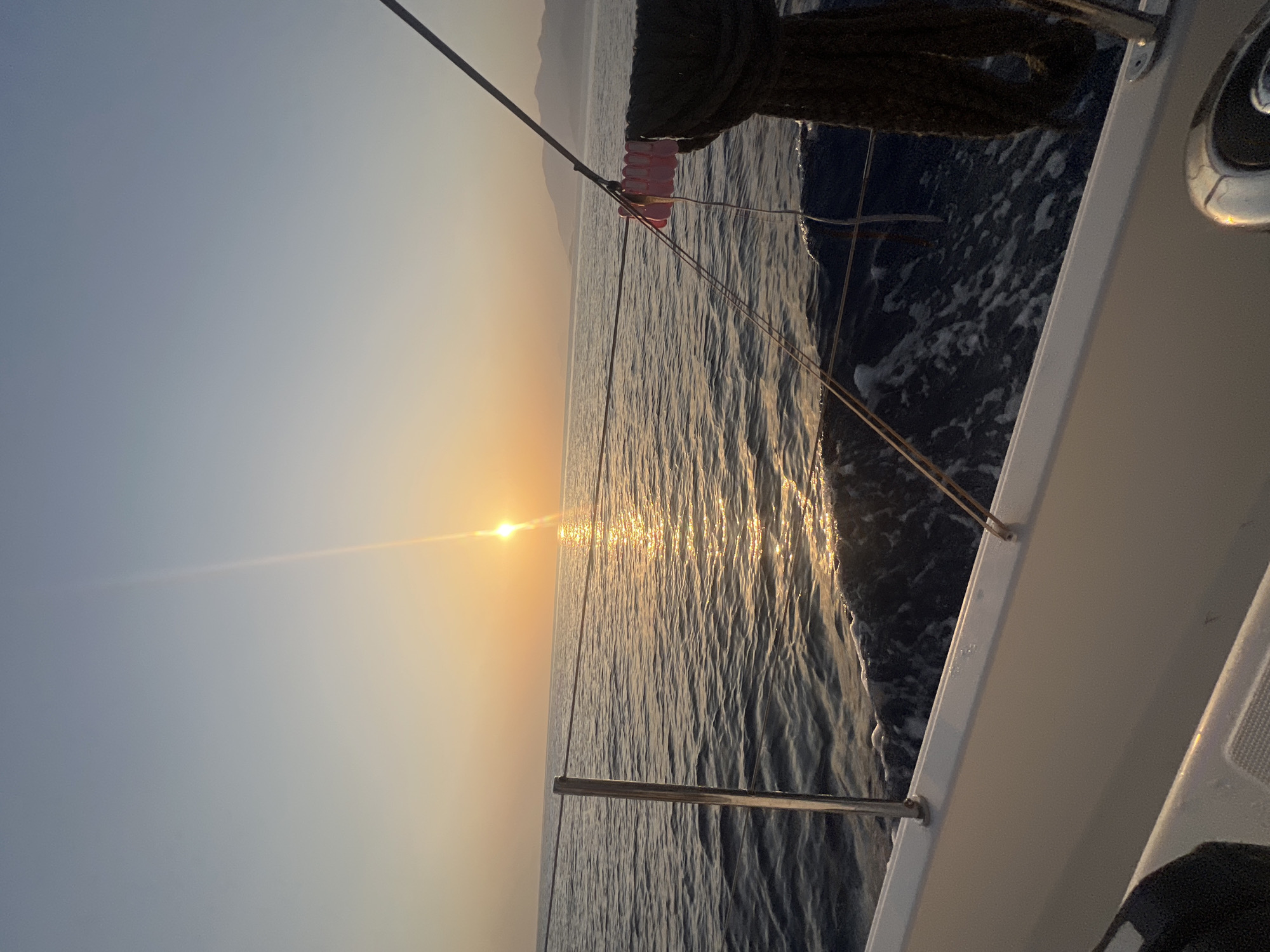 On a sailboat at sea during golden hour