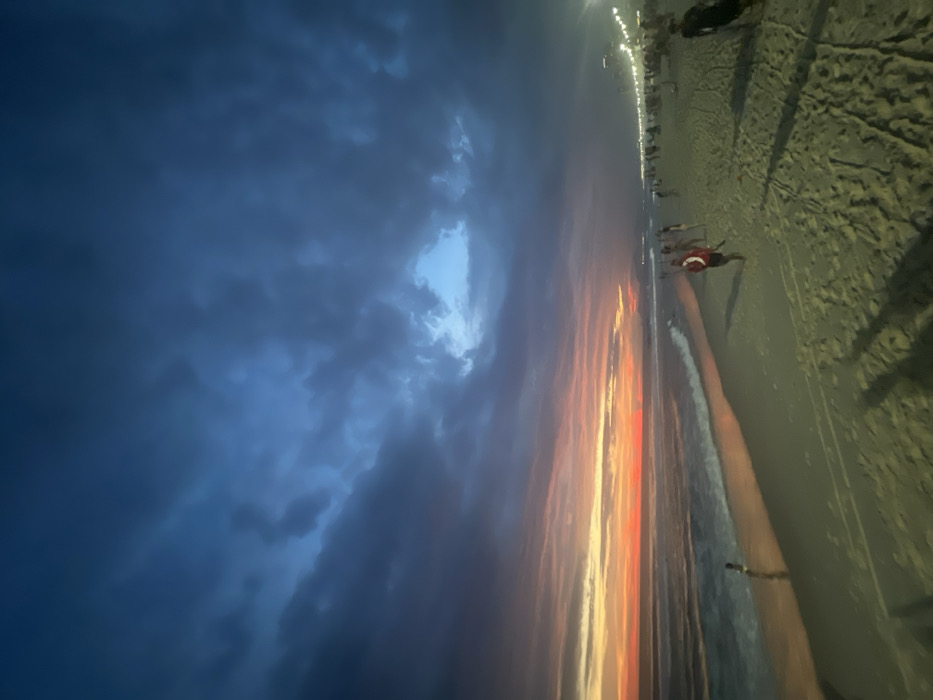 Dramatic sunset meets storm clouds over Rio beach