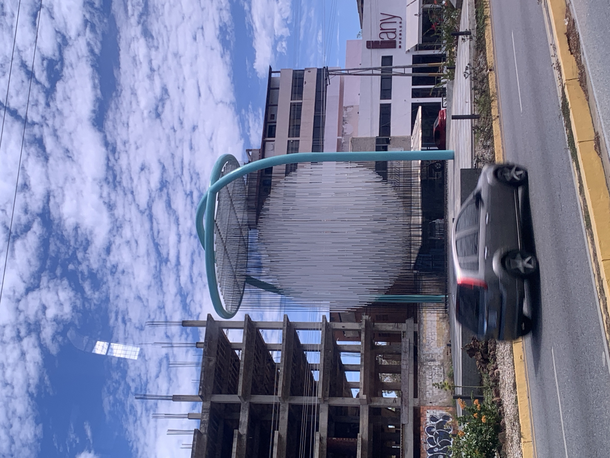 Construction continues near sculpture in Pampatar, Venezuela