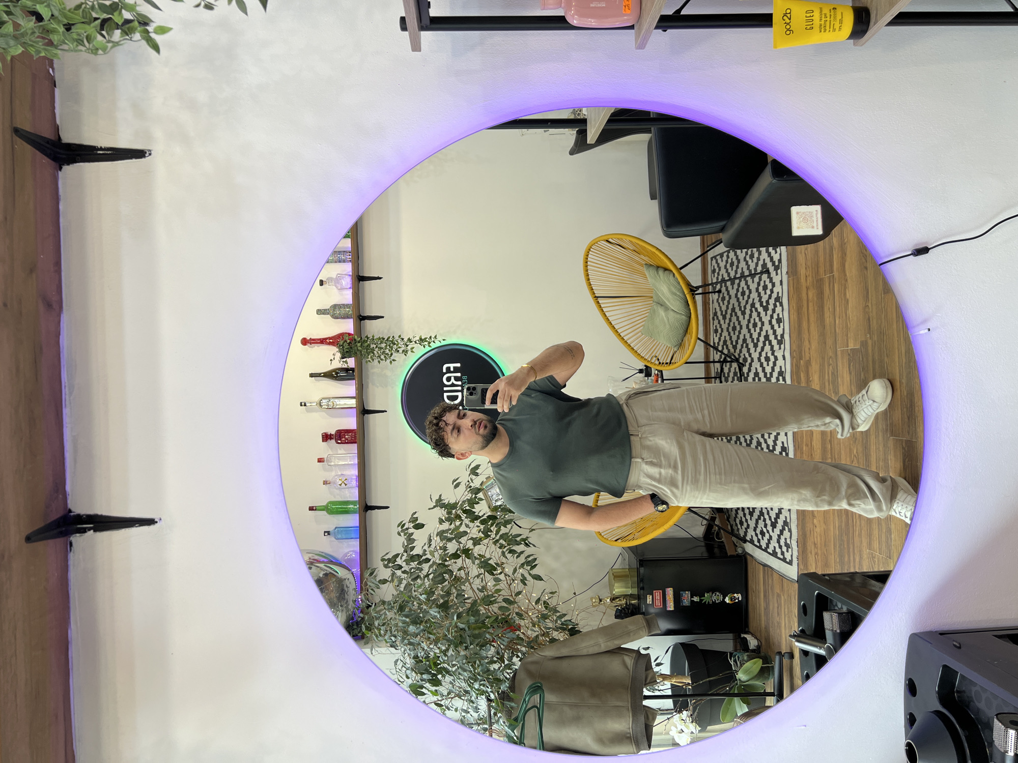 Man takes selfie in illuminated mirror in Sofia