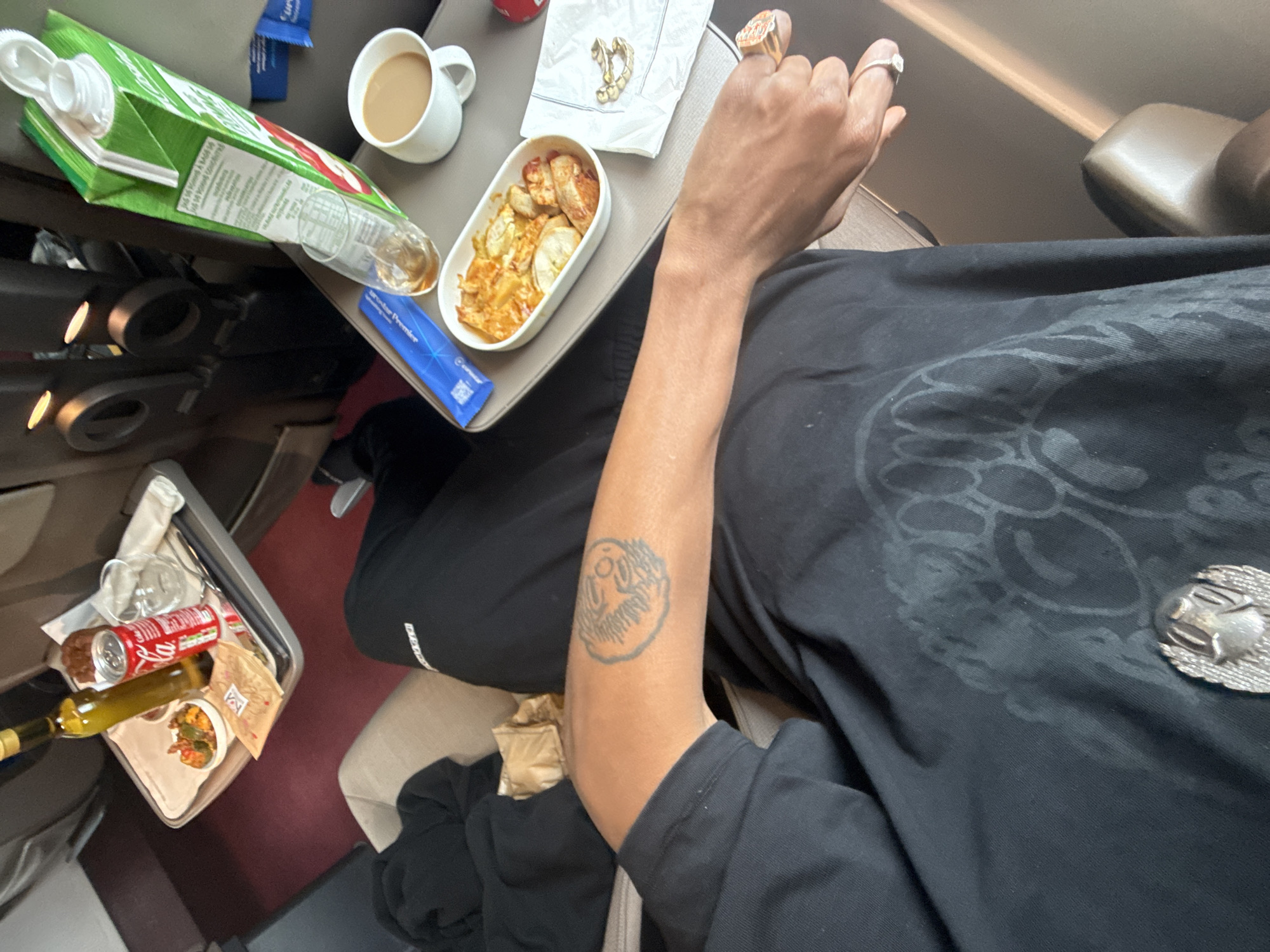 Airline passenger enjoys in-flight meal service over northern France