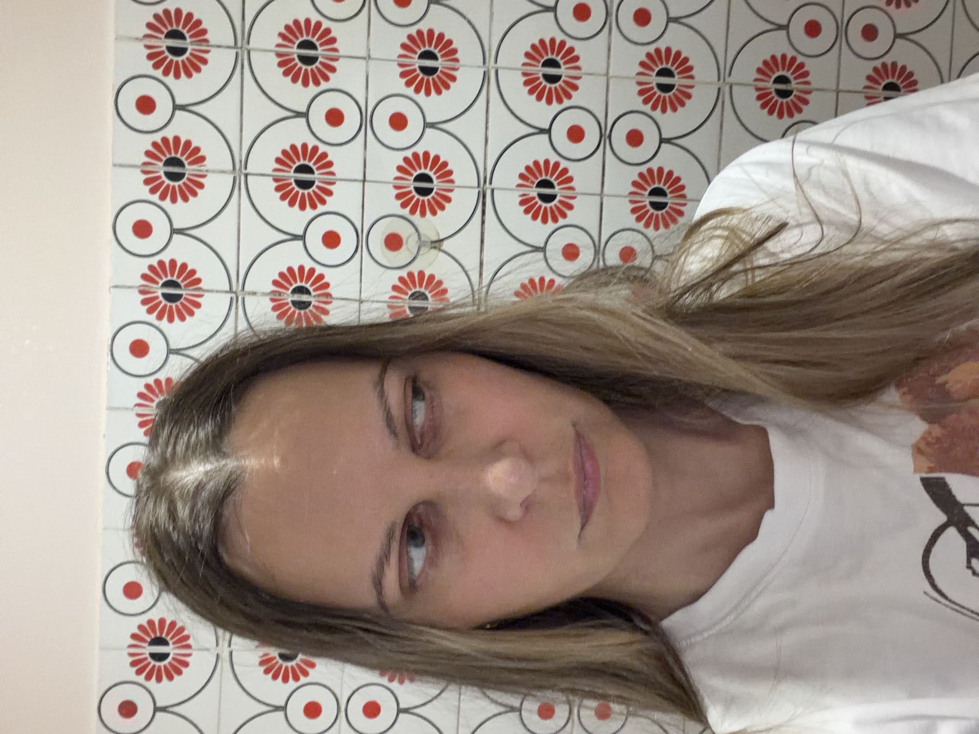 Woman documents evening routine in Izhevsk apartment bathroom