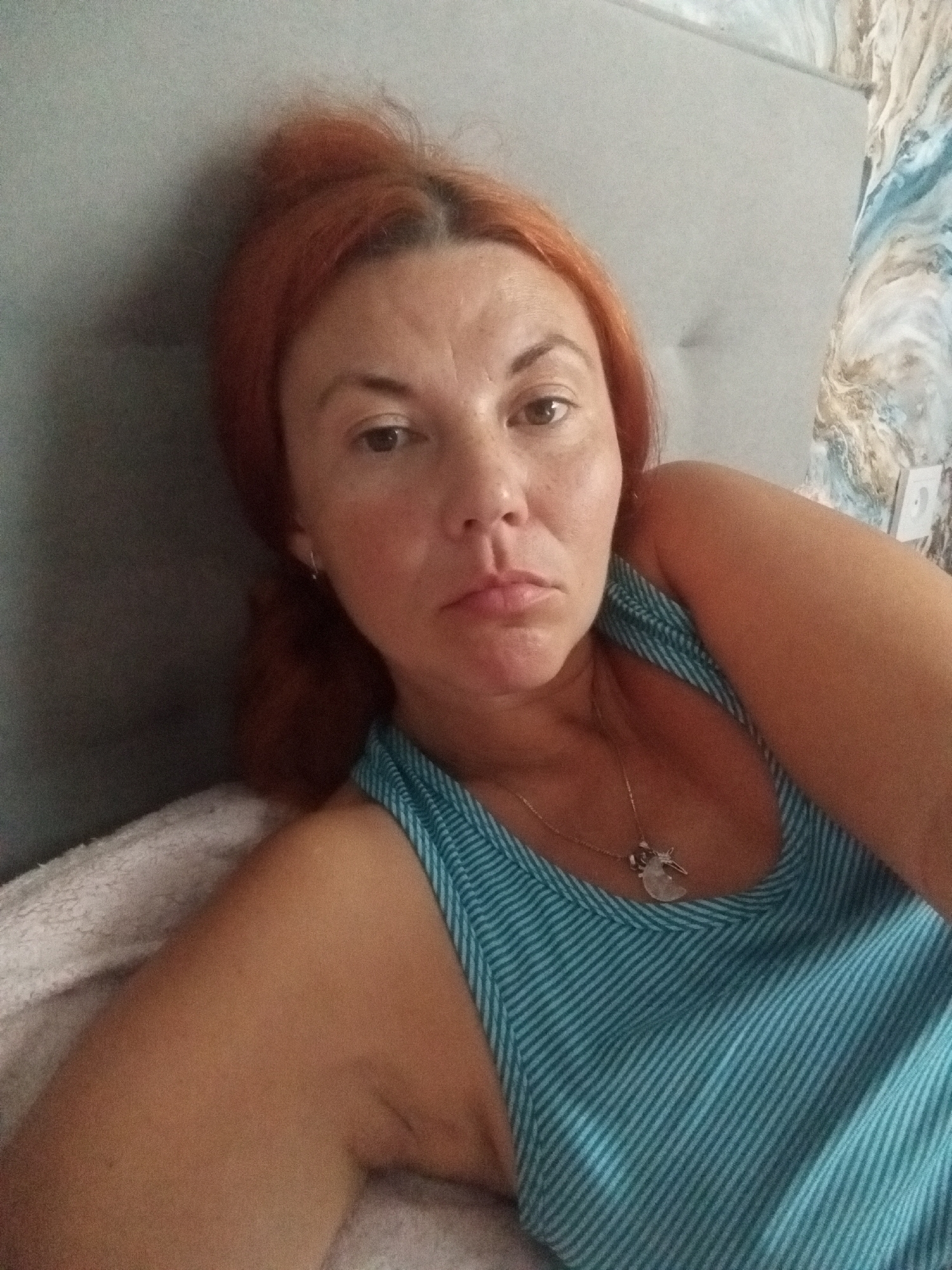 Casual selfie series, lying down, direct camera gaze