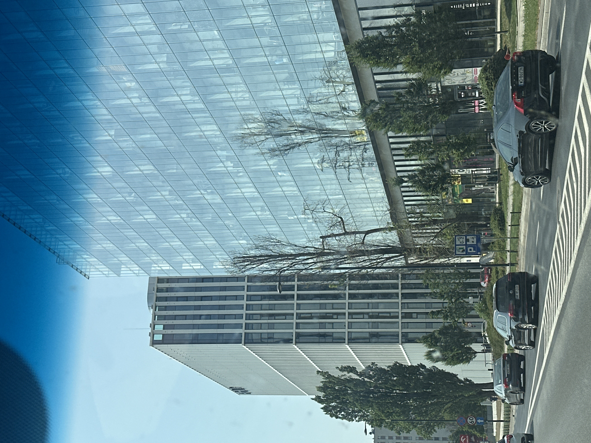 Warsaw's glass office towers seen from a passing vehicle