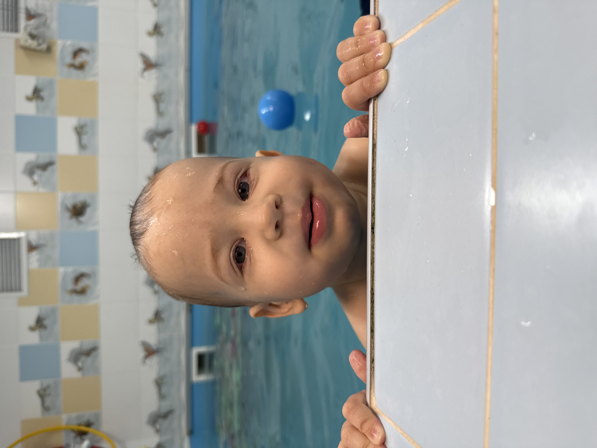Child enjoys early morning swim session in Rusanovo pool