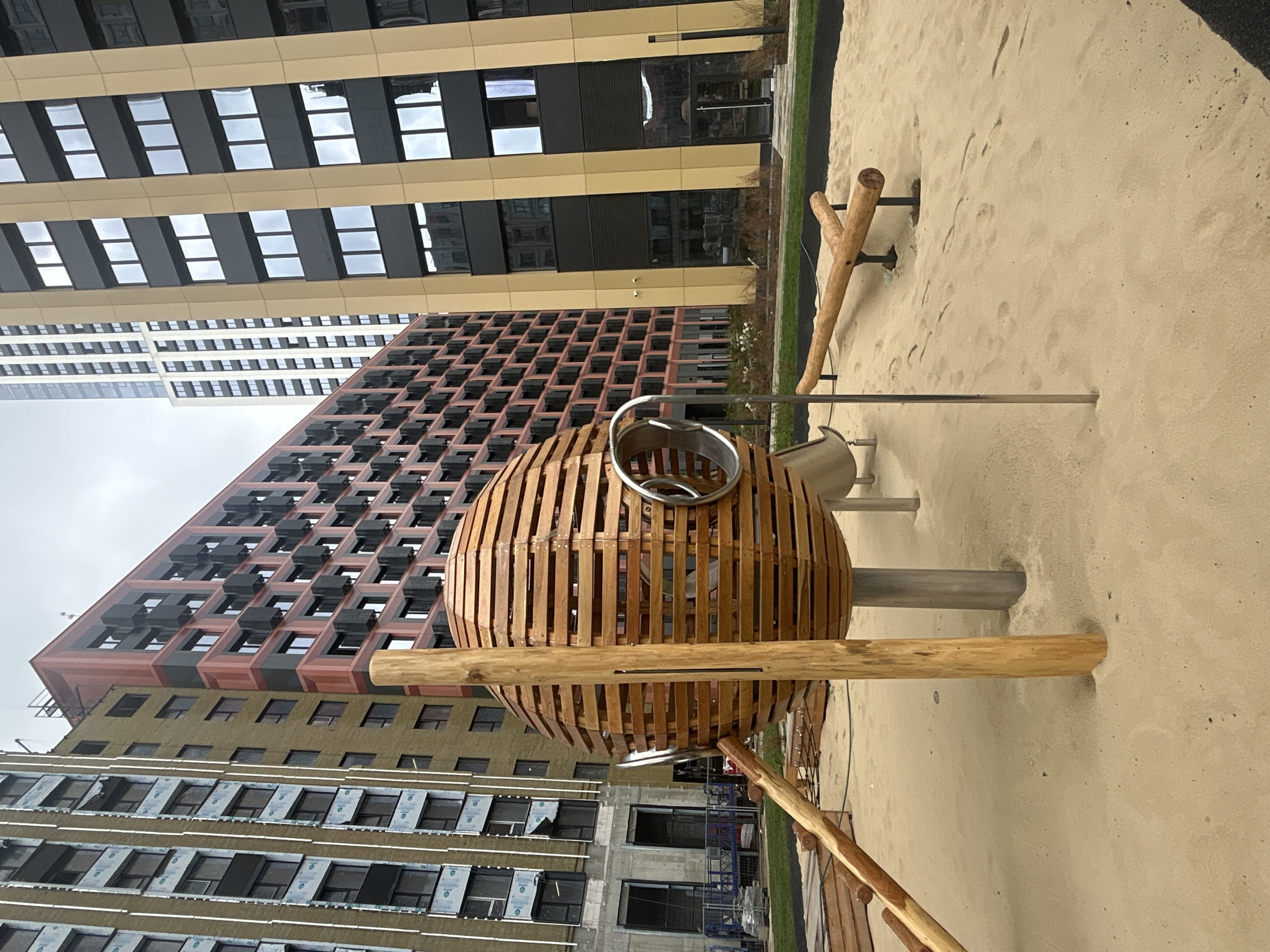 Modern buildings, playgrounds, and garden paths in an urban setting