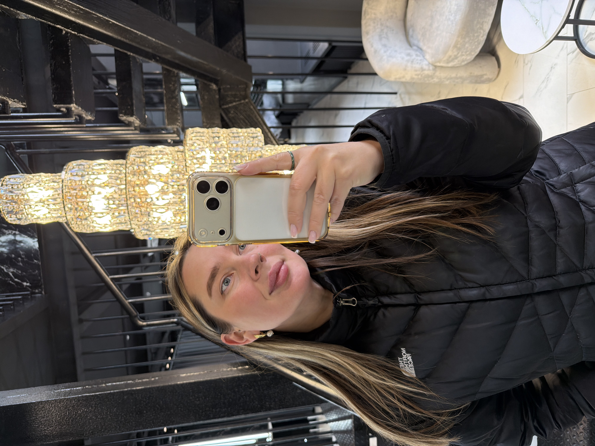 Woman takes selfie on stairs in Moscow building