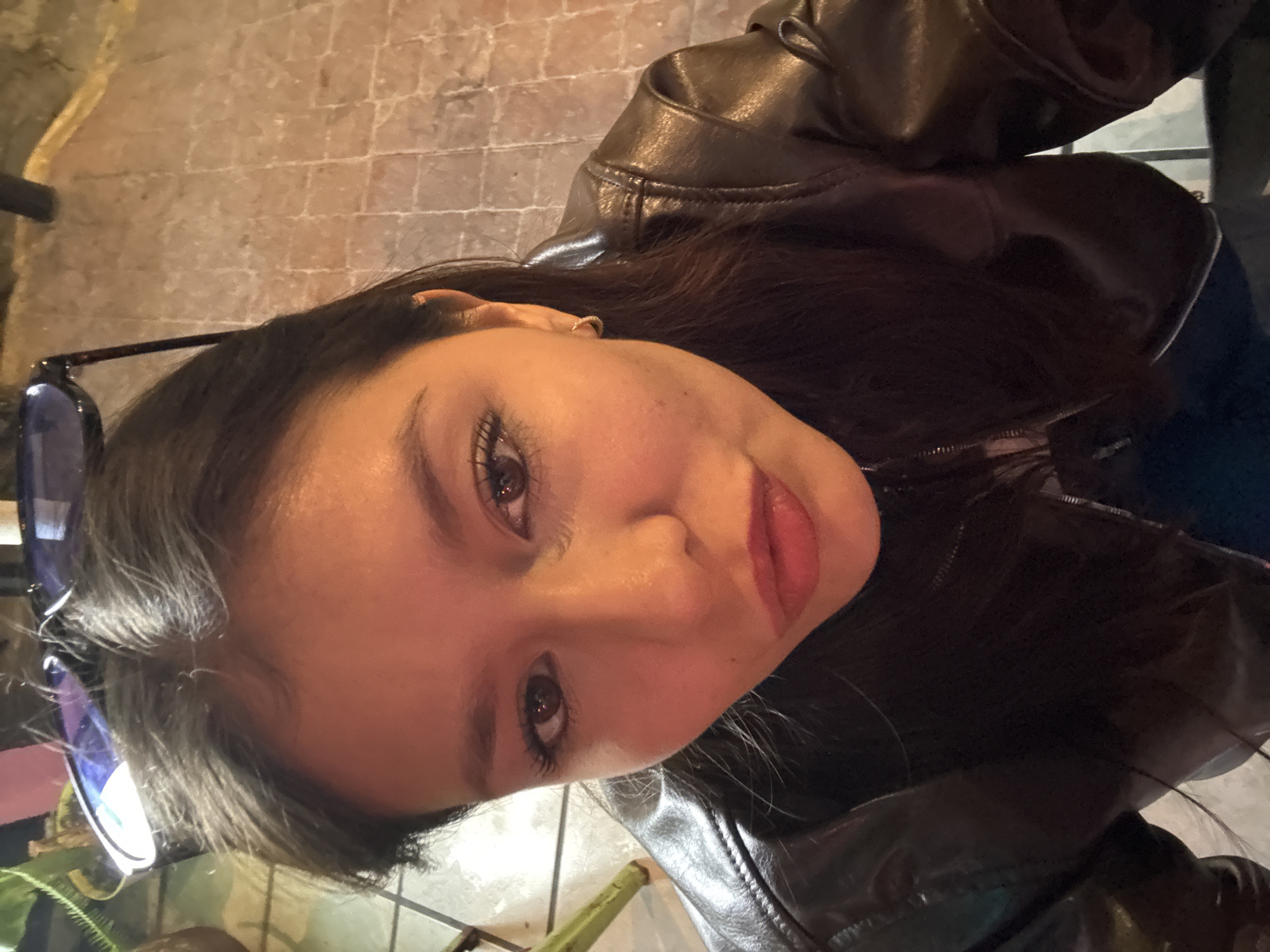 Woman in leather jacket photographed indoors in Cholula