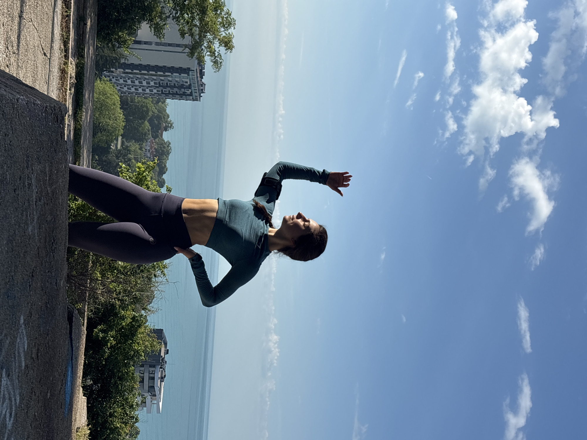 Woman performs yoga pose outdoors in Varna, Bulgaria