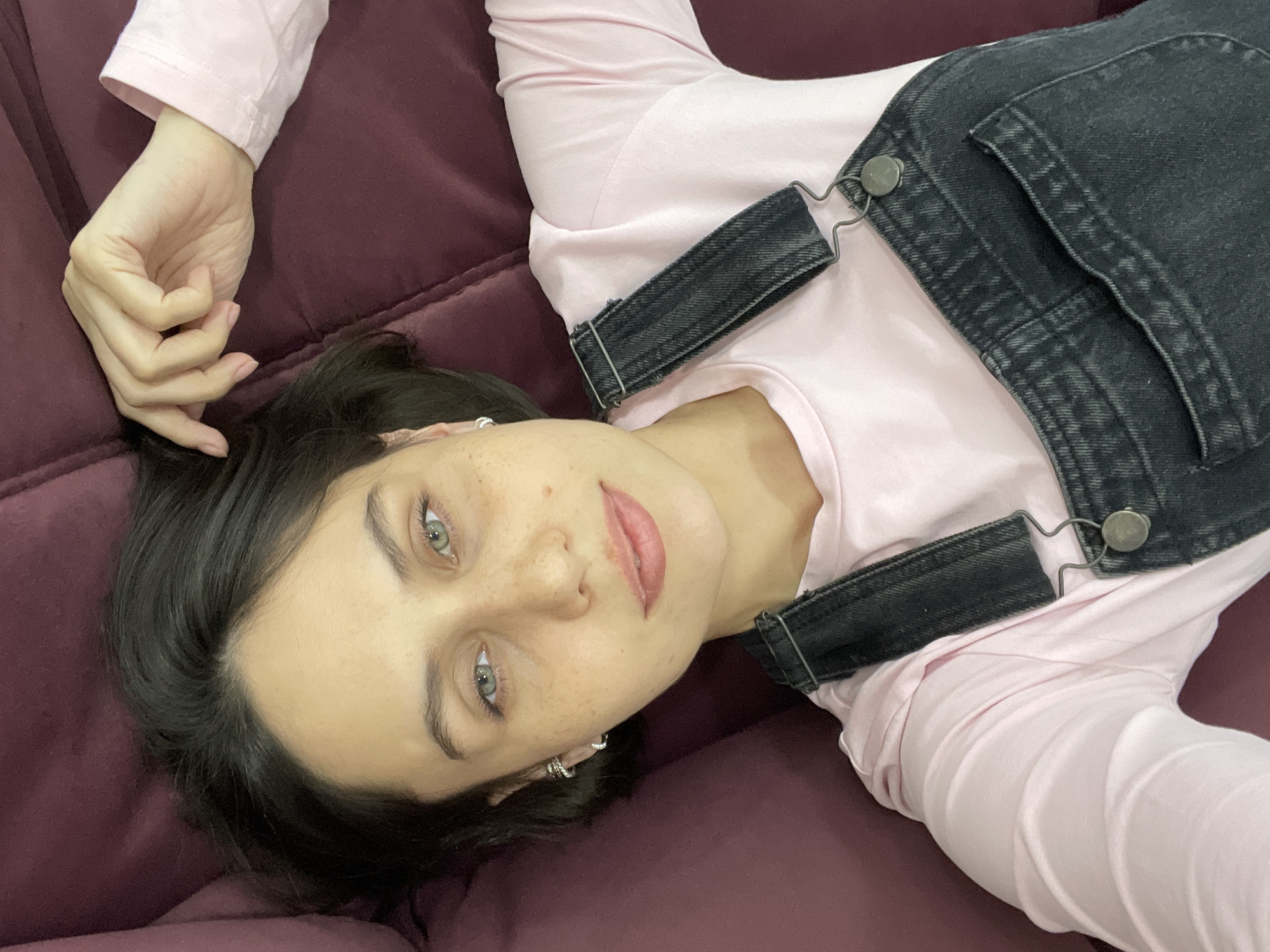 Woman rests on sofa in Izhevsk morning scene