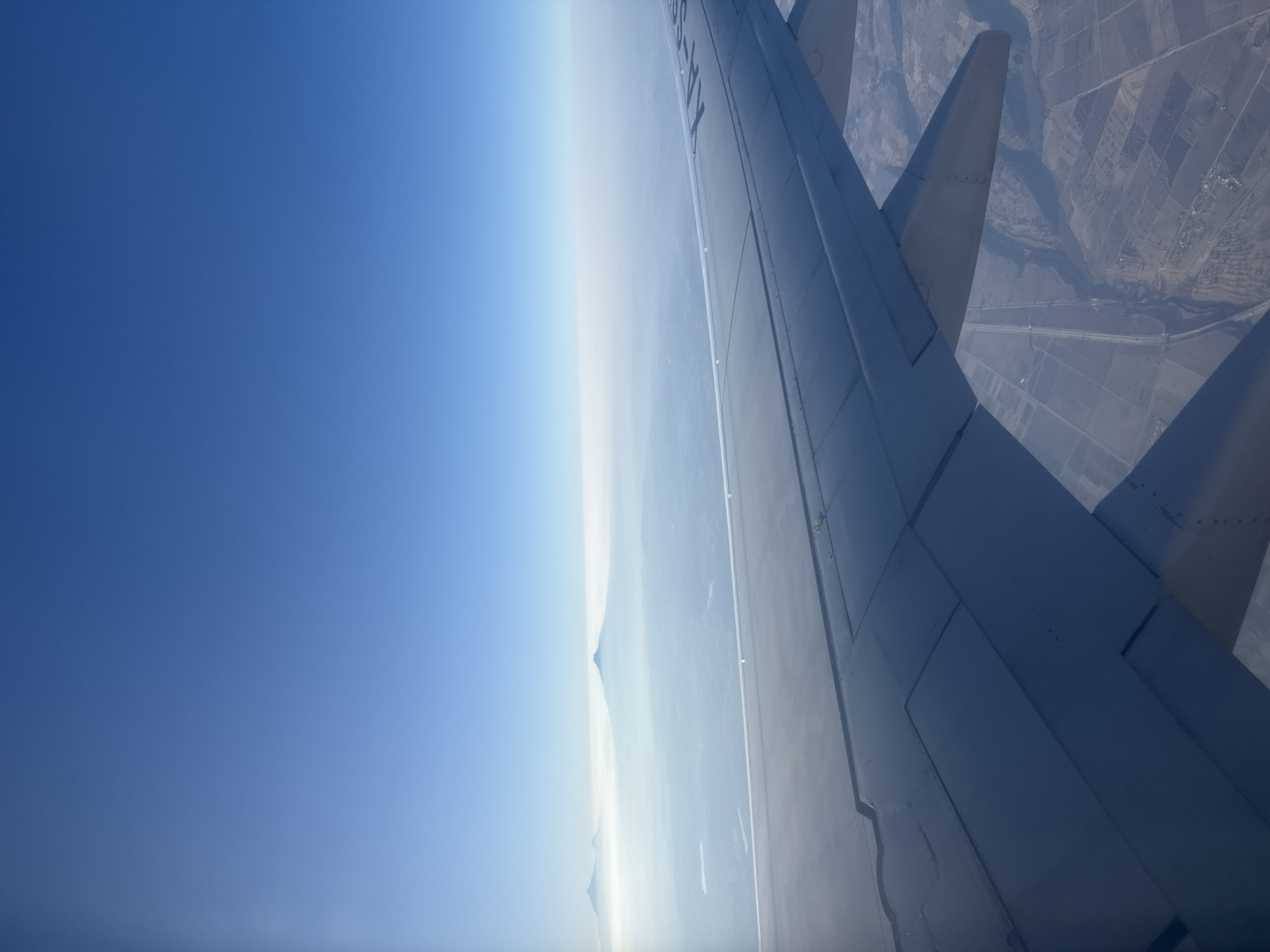 Passenger photographs mountain view from airplane over Miami Beach