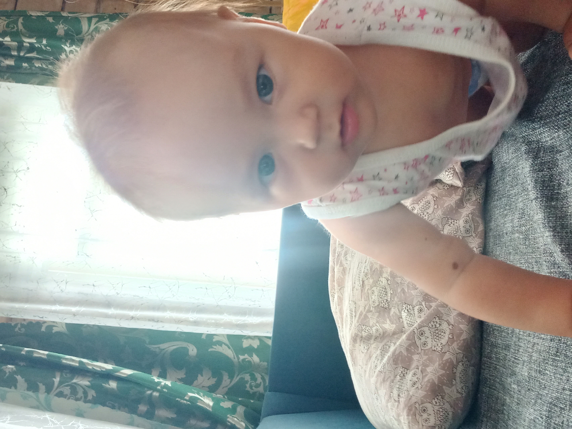 Baby crawling on a couch indoors in Идрисово