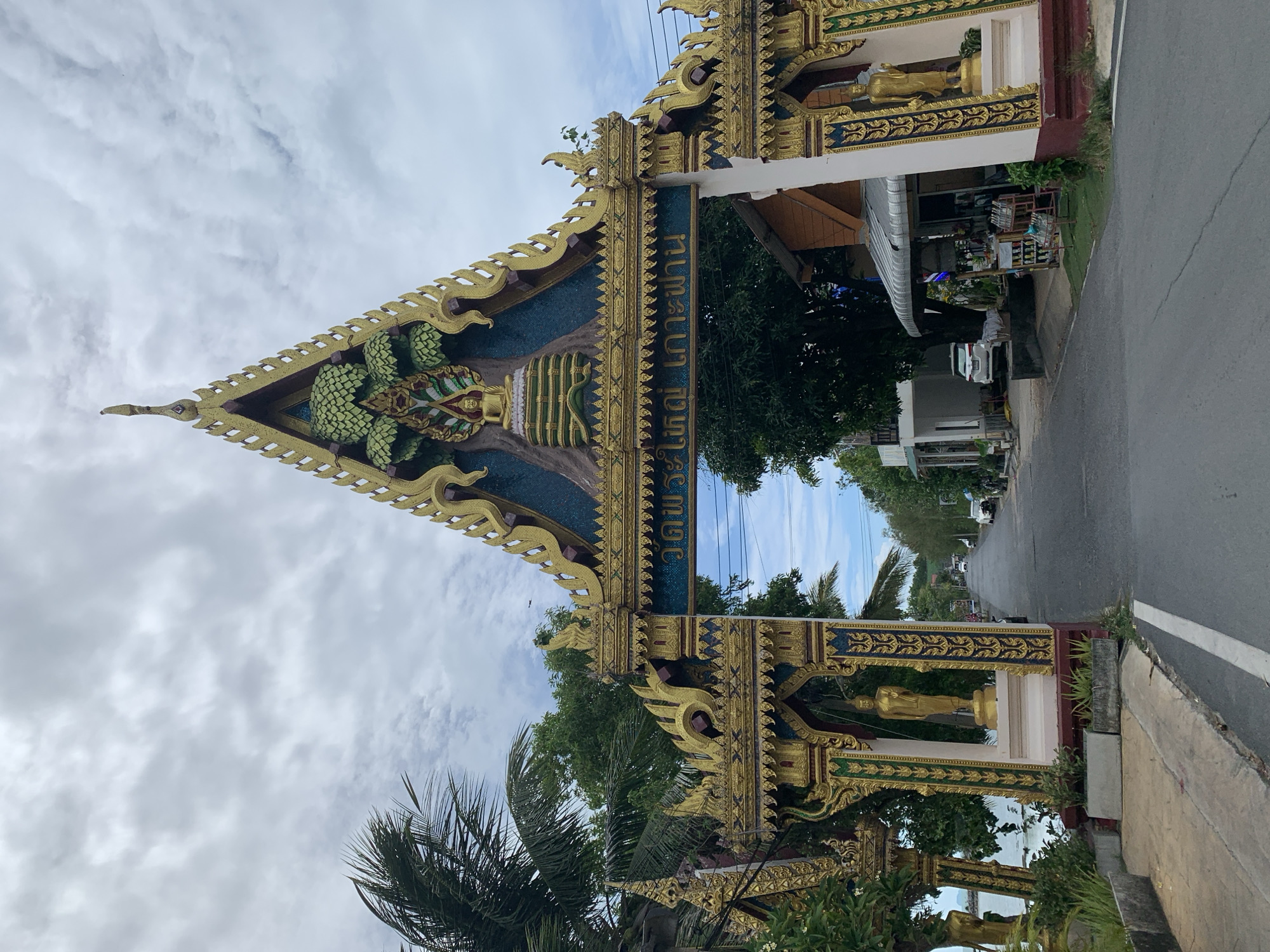 Thai temple architecture and coastline documented in Baan Plai Laem