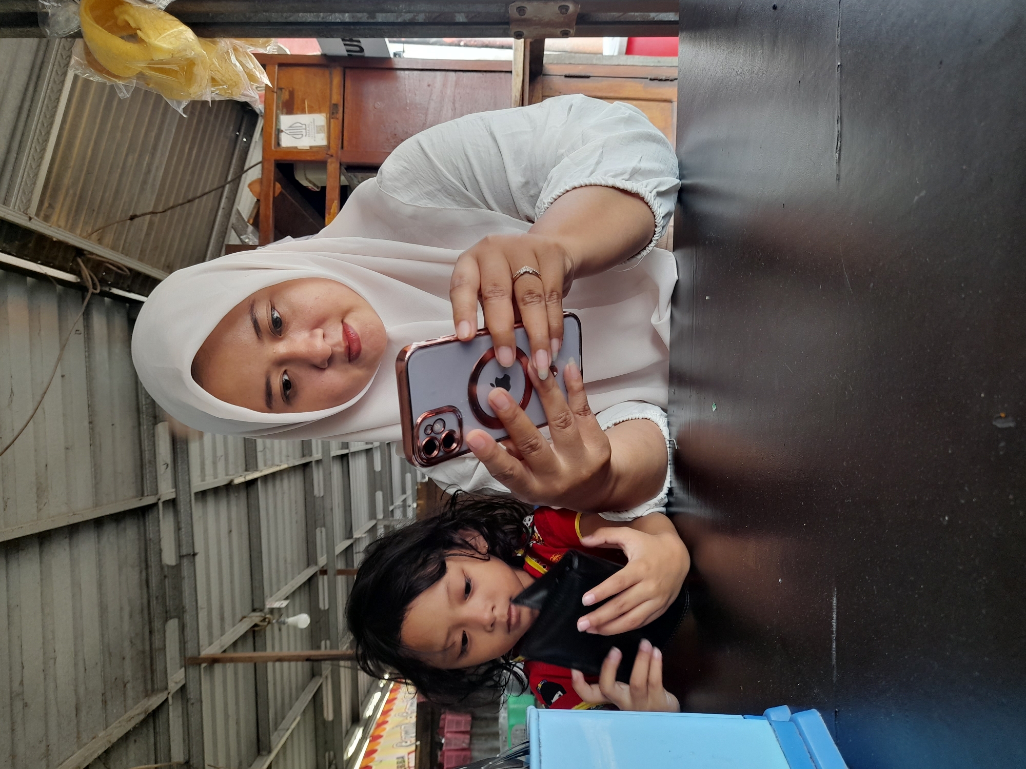 Family shares meal, photos at waterside restaurant in Indonesia