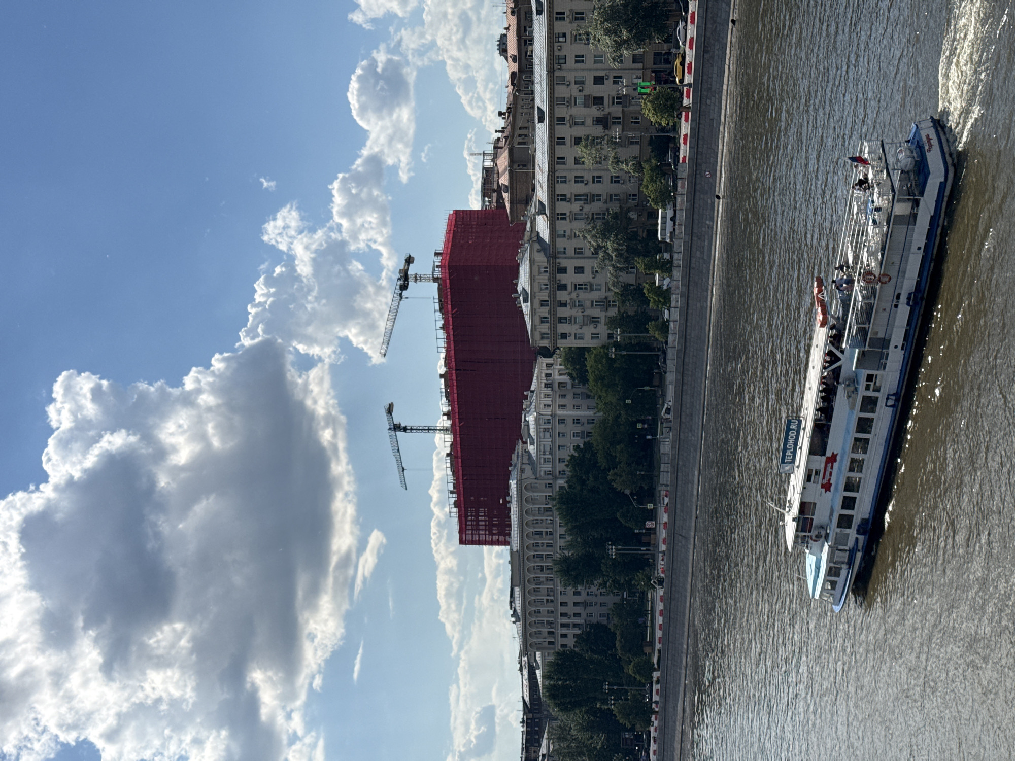 Midday scenes captured along Moscow River showing boats, skyline