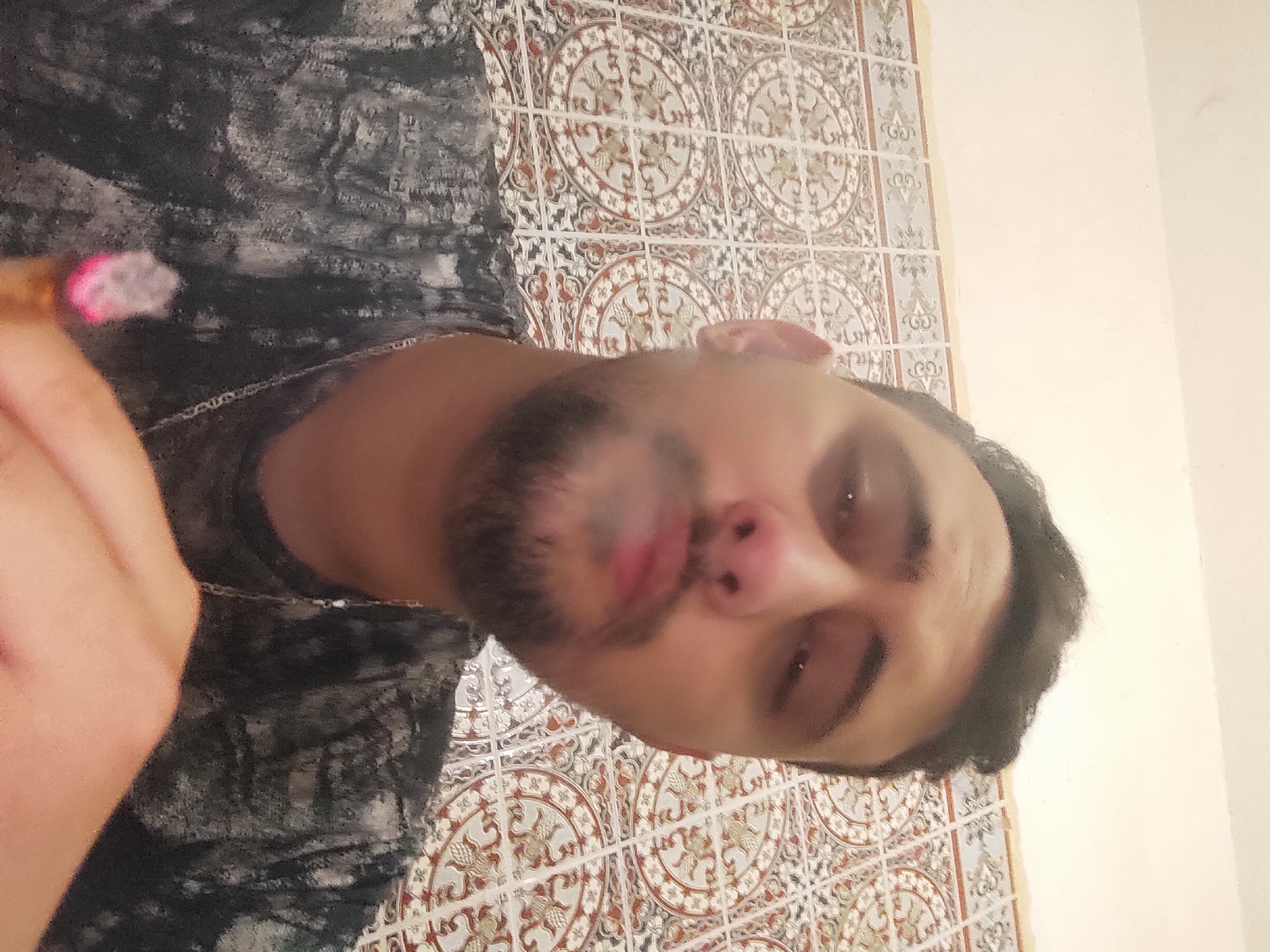 Man photographed in indoor portraits in Meknes, Morocco