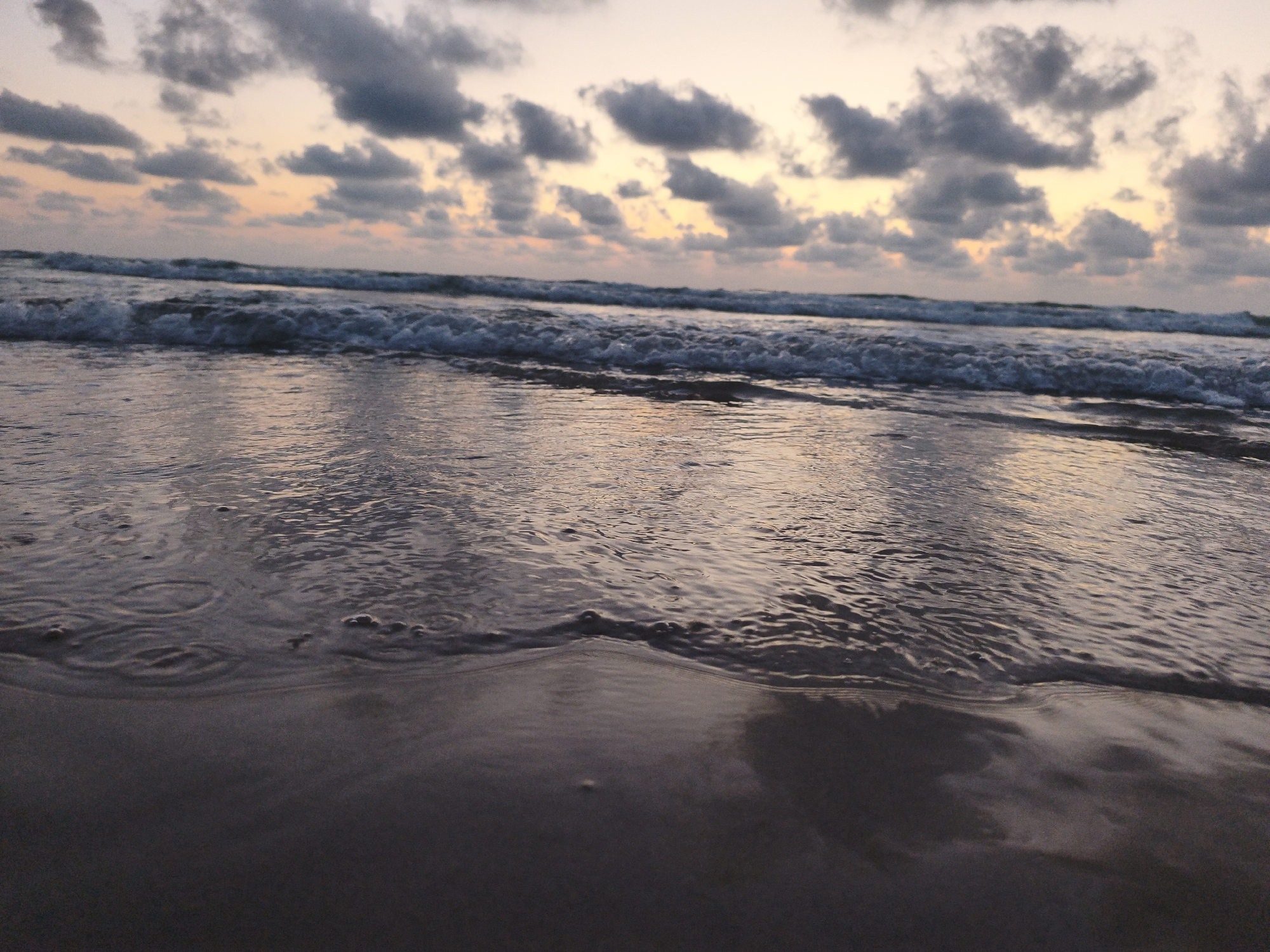 Sunset waves on the Mediterranean shore in Hadera