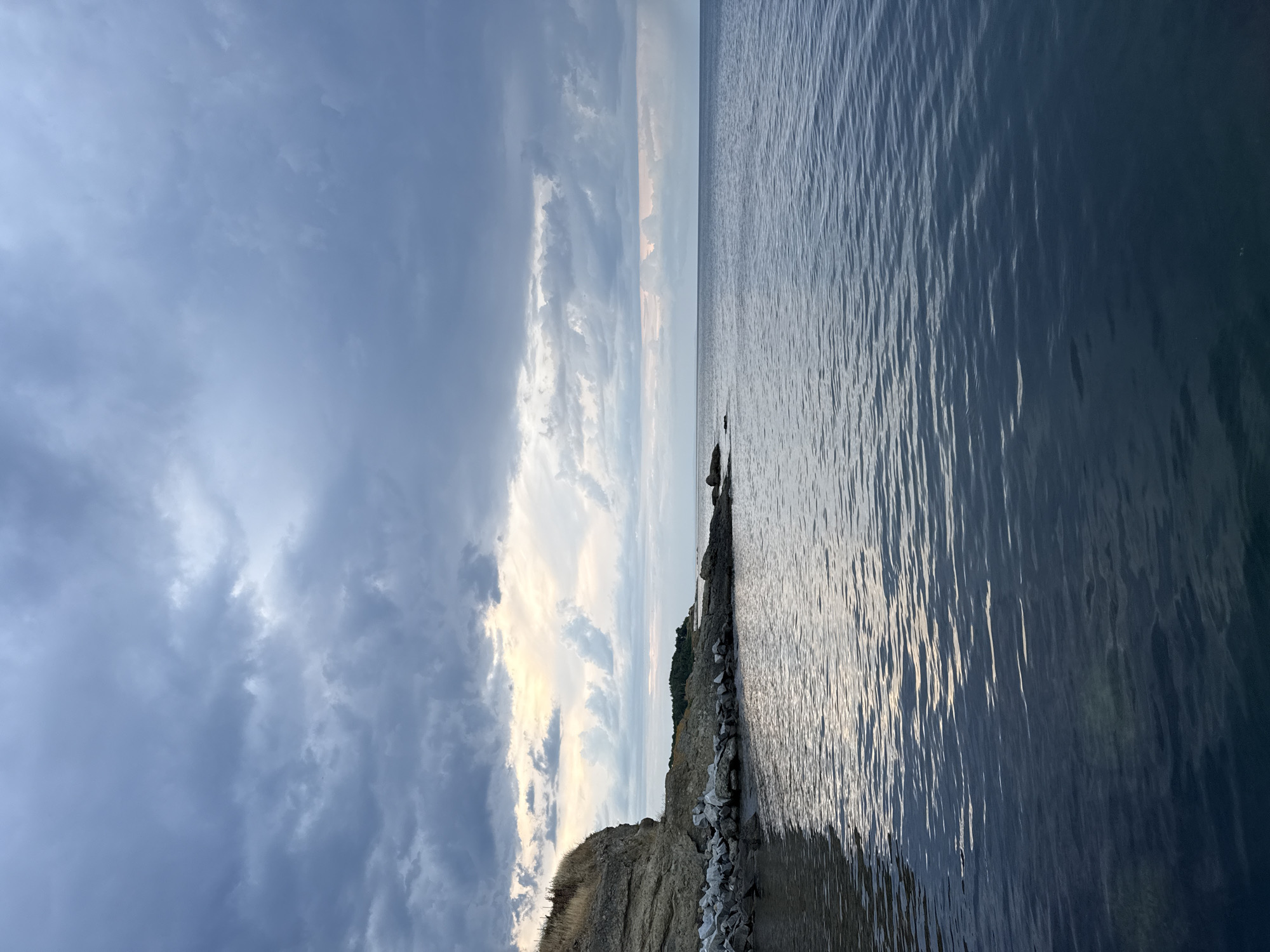 Rocky Black Sea coast at Tsarevo, chapel and beacon in view
