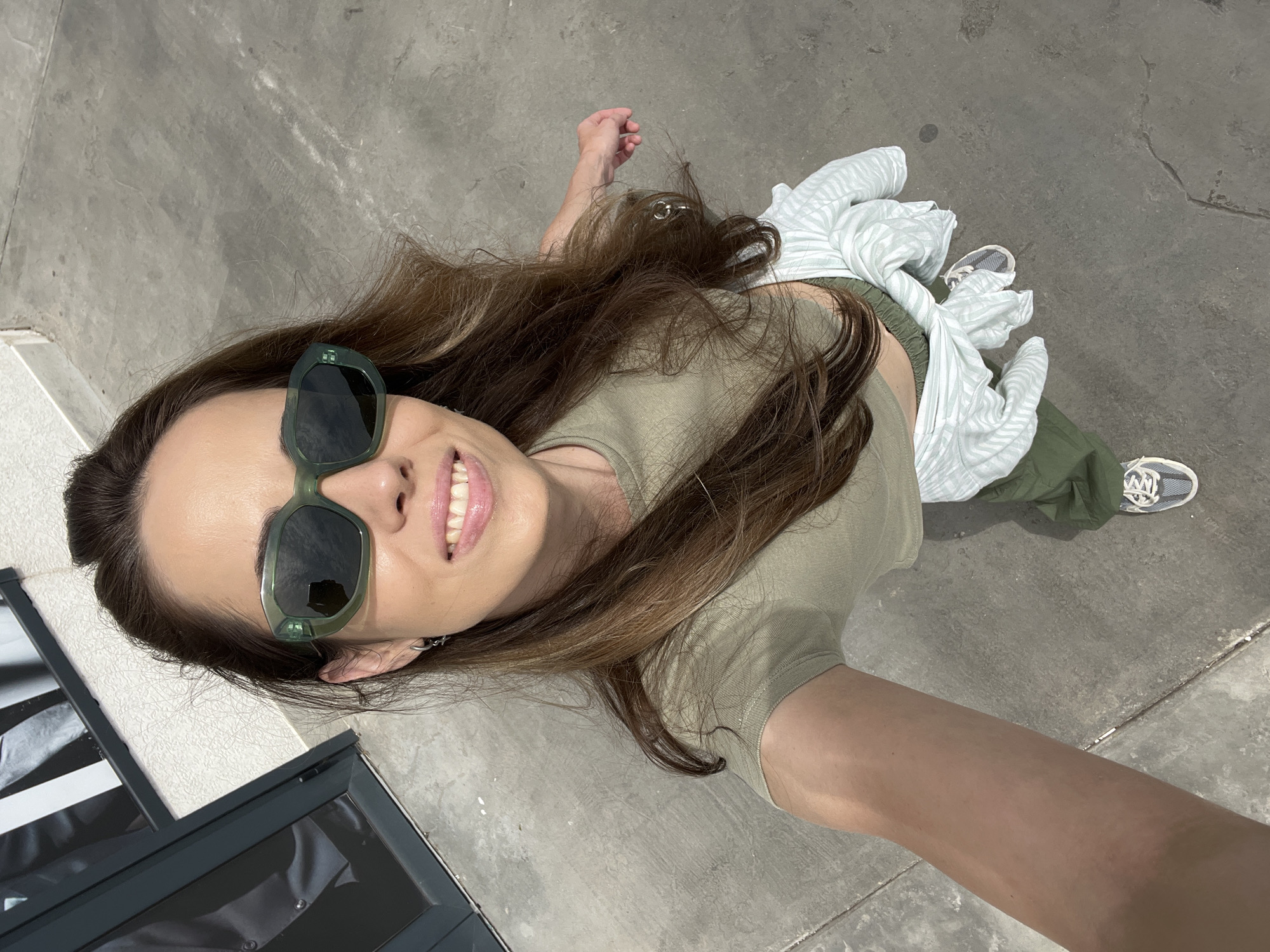 Woman takes selfies, feeds cat in Montenegro village morning
