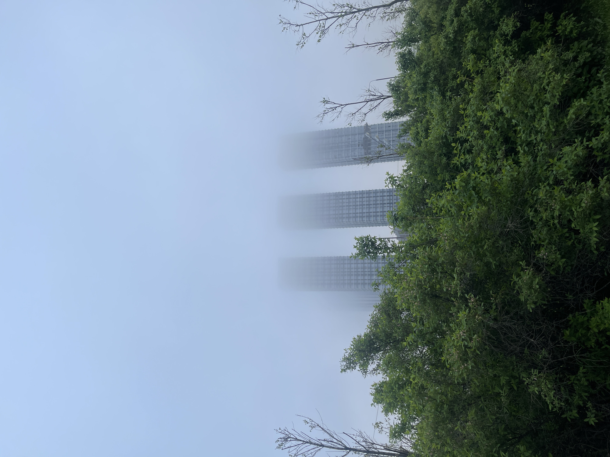 Fog envelops Moscow skyscrapers in early morning scene