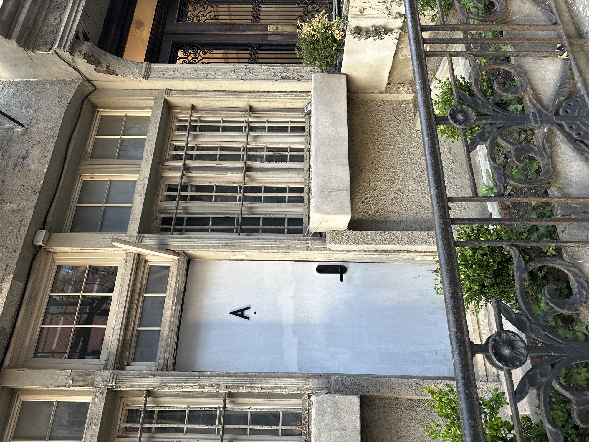 NYC residents photograph neighborhood buildings on late evening walk