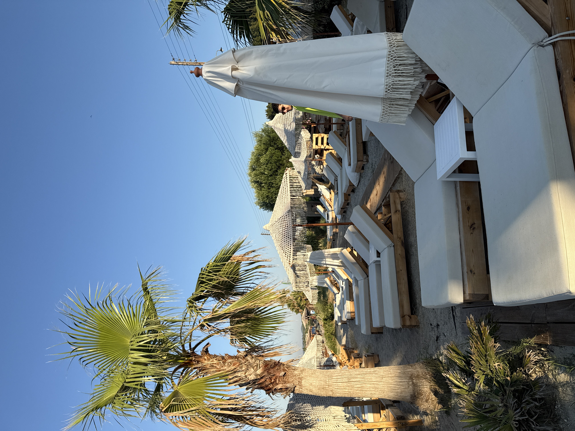 Sunny beach lounge scene in Pallini, Greece