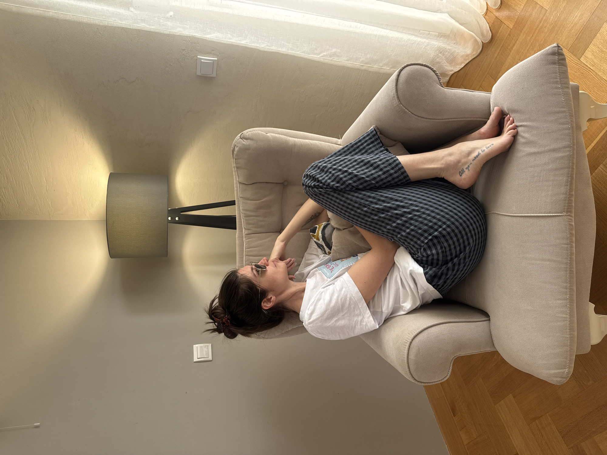 Woman enjoys quiet morning moments in Podgorica apartment
