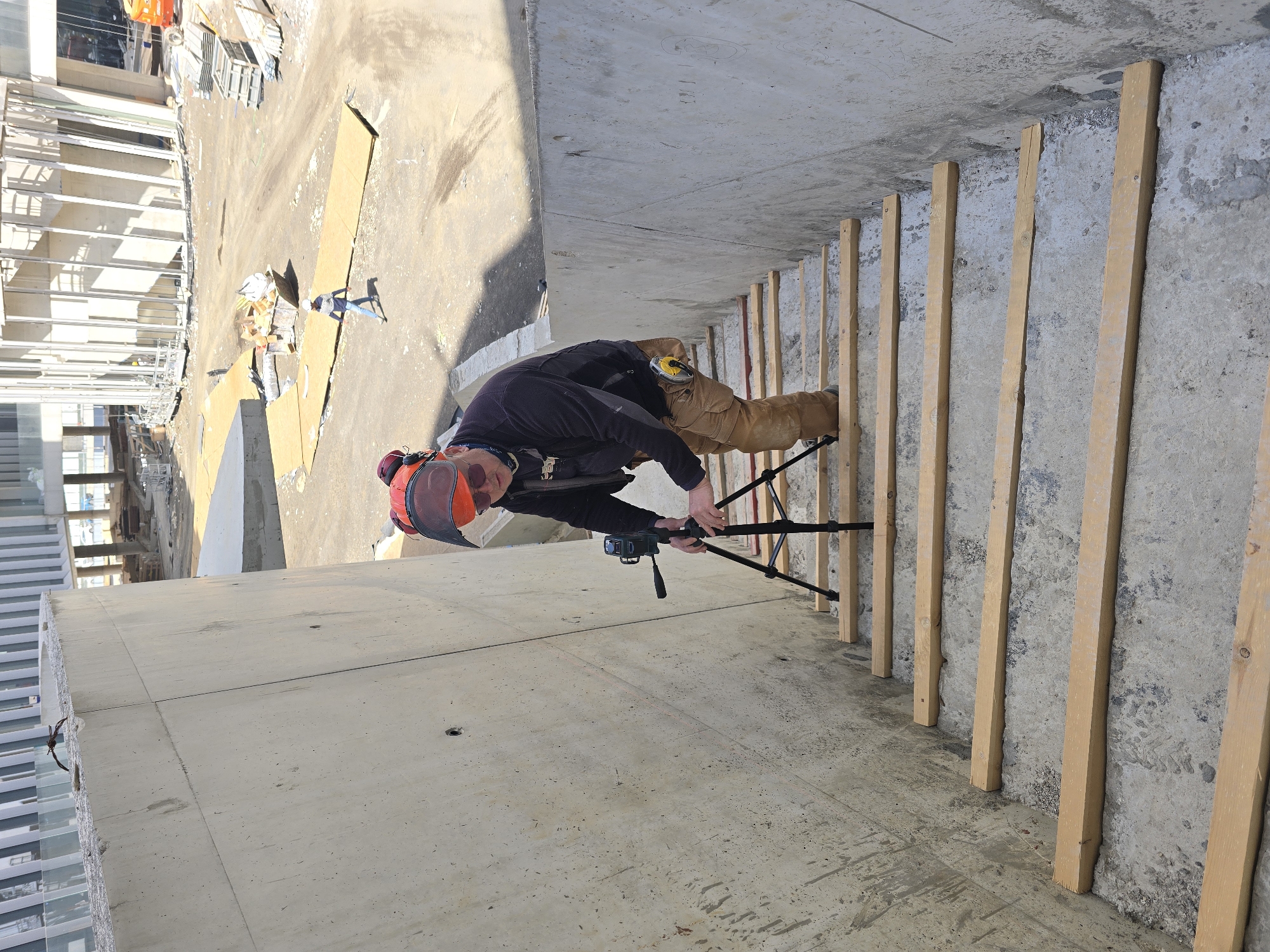 Construction worker observed on unfinished building balcony