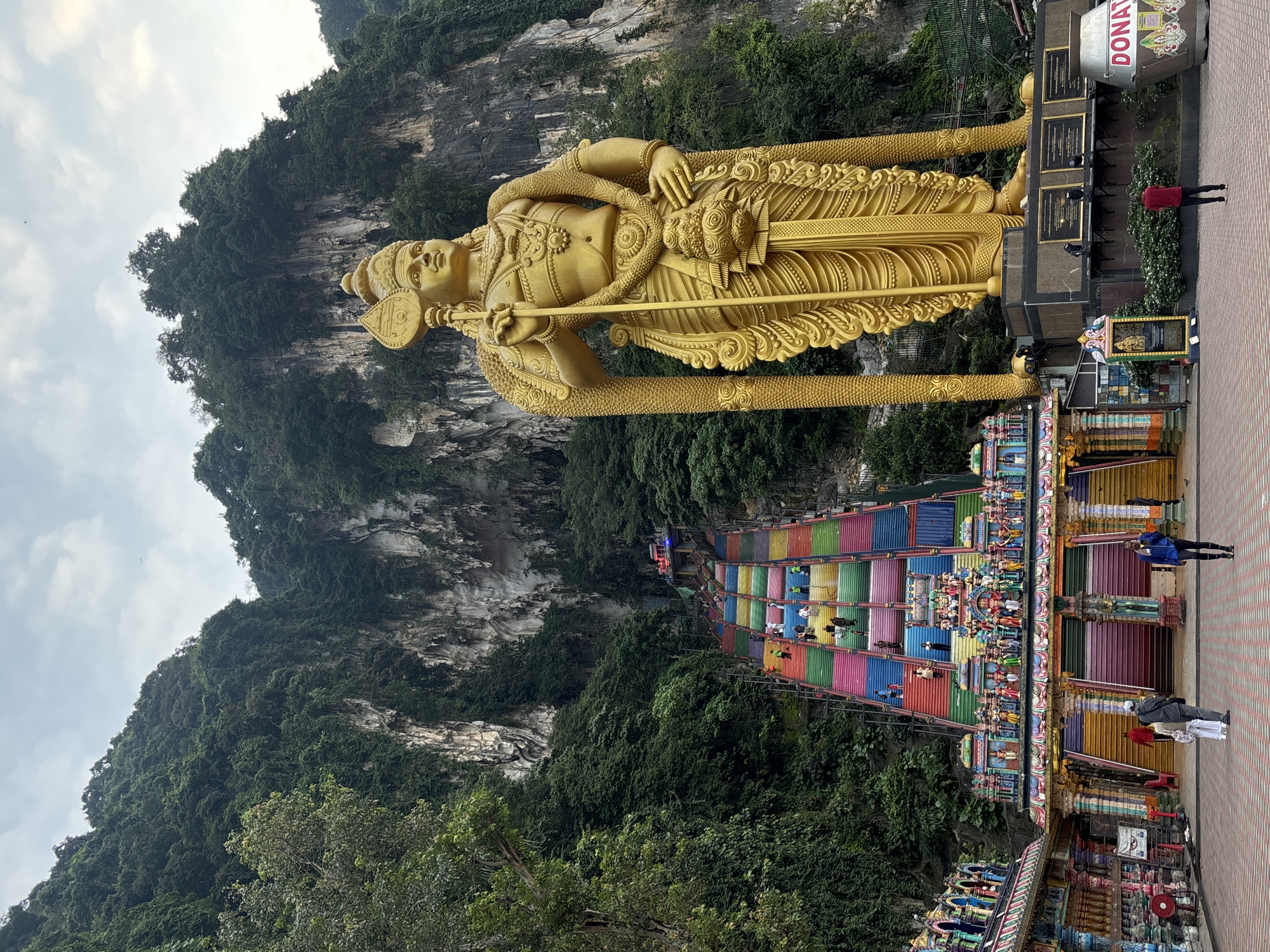 Golden statues, vivid temple architecture, and wildlife at a Selayang Hindu complex
