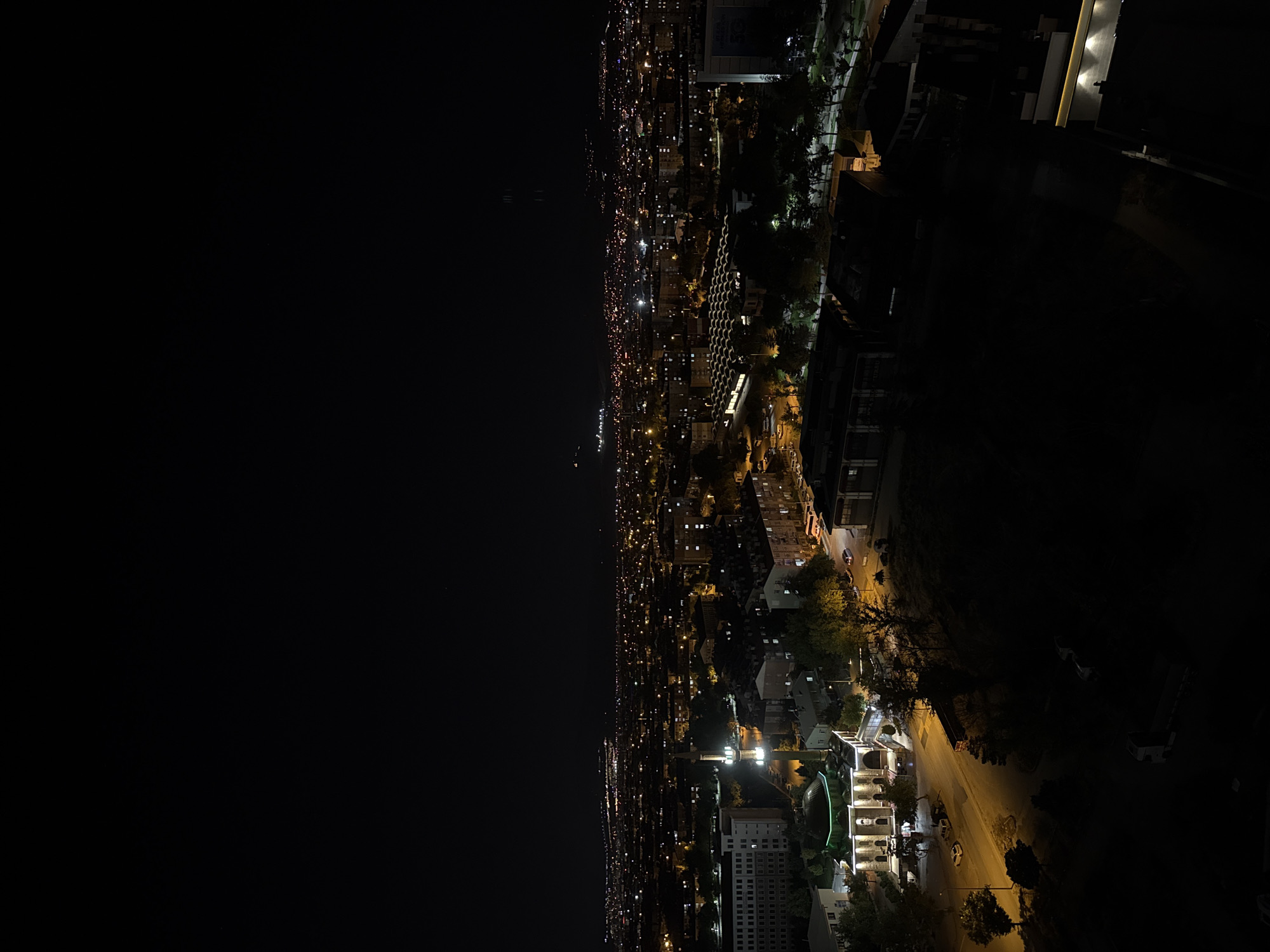 Konya skyline transitions from dusk to night, minarets lit up
