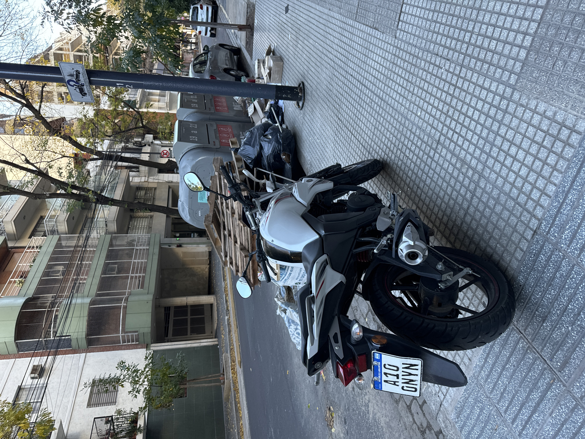 Buenos Aires resident documents street life, personal belongings during evening