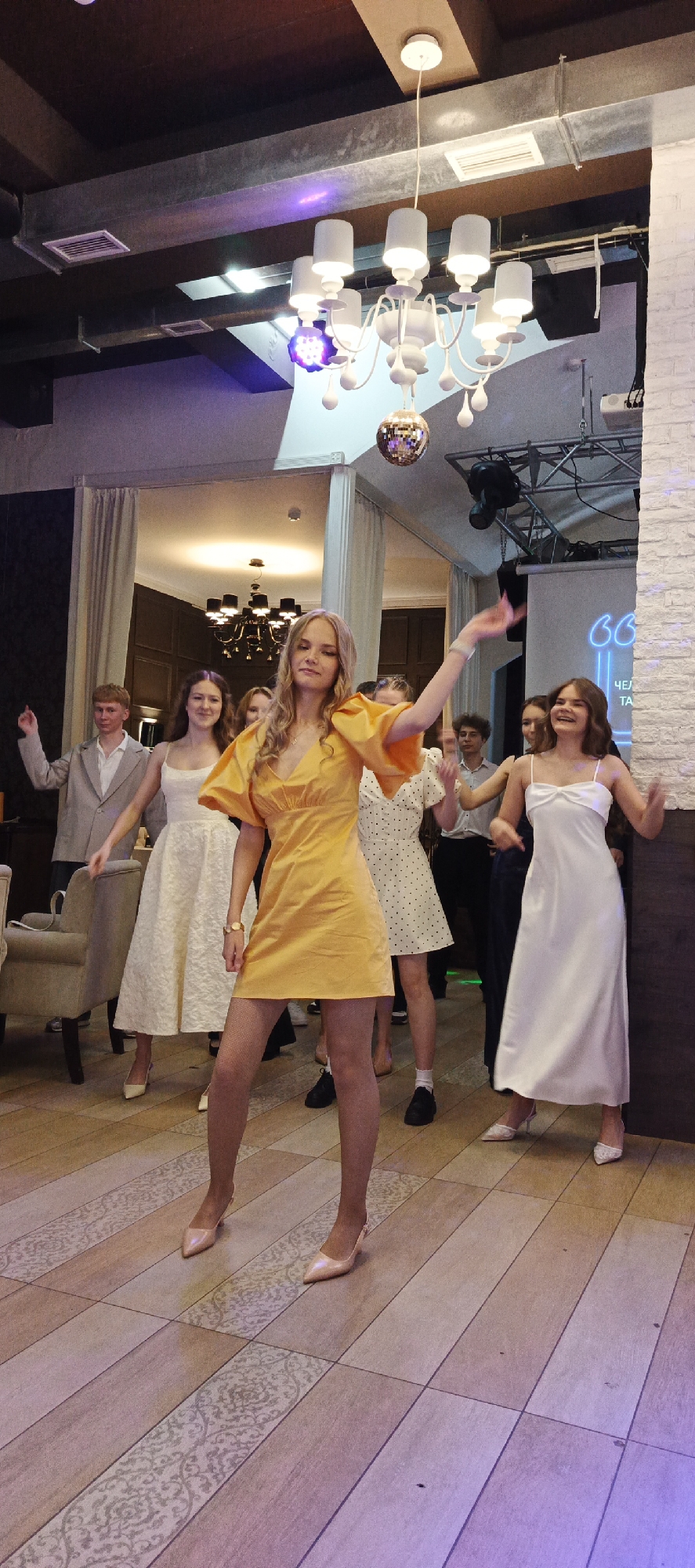 Formal celebration and dancing at a venue in Chaikovsky, Russia