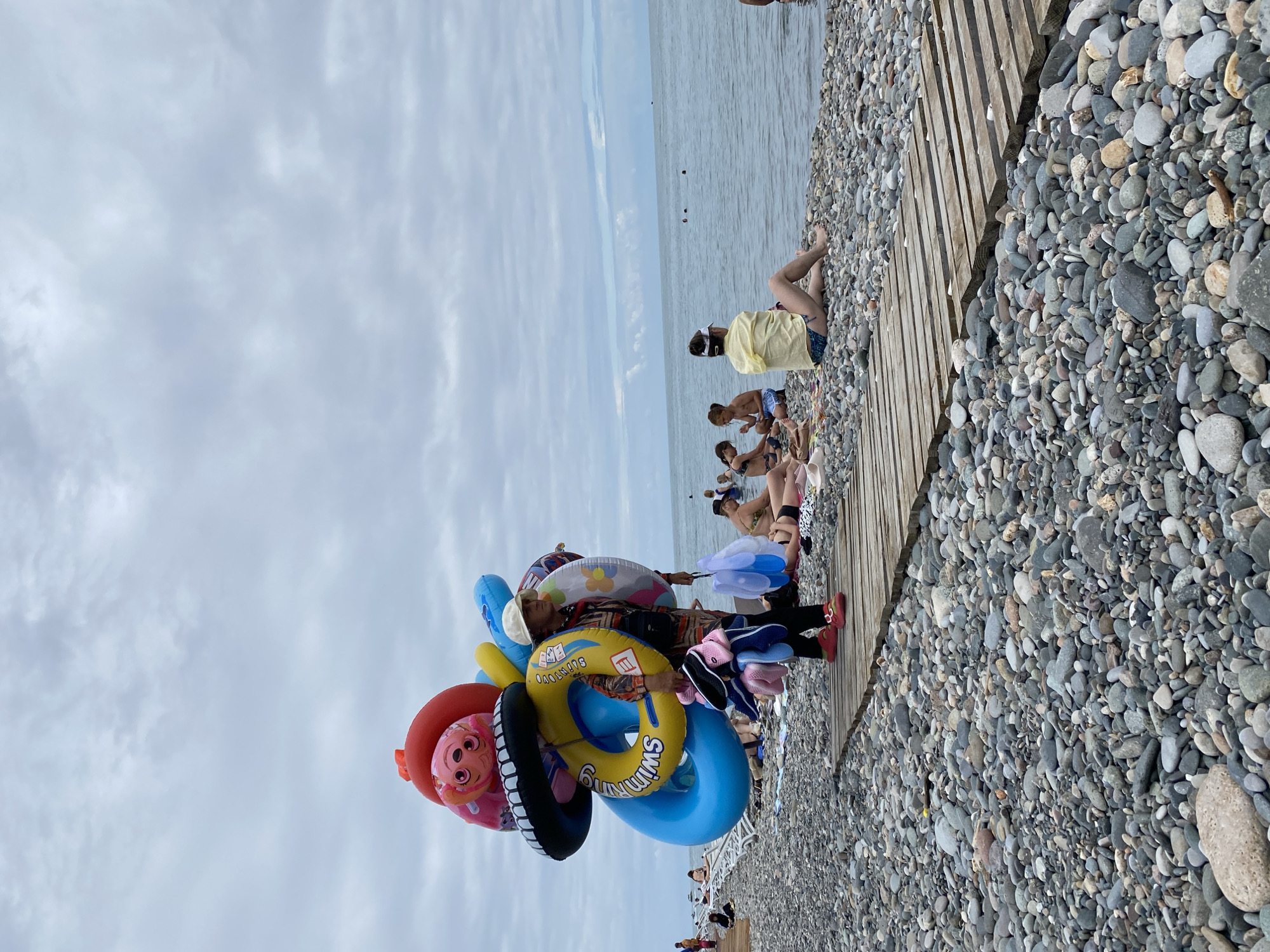 Cloudy morning on Batumi's pebble beach and boulevard