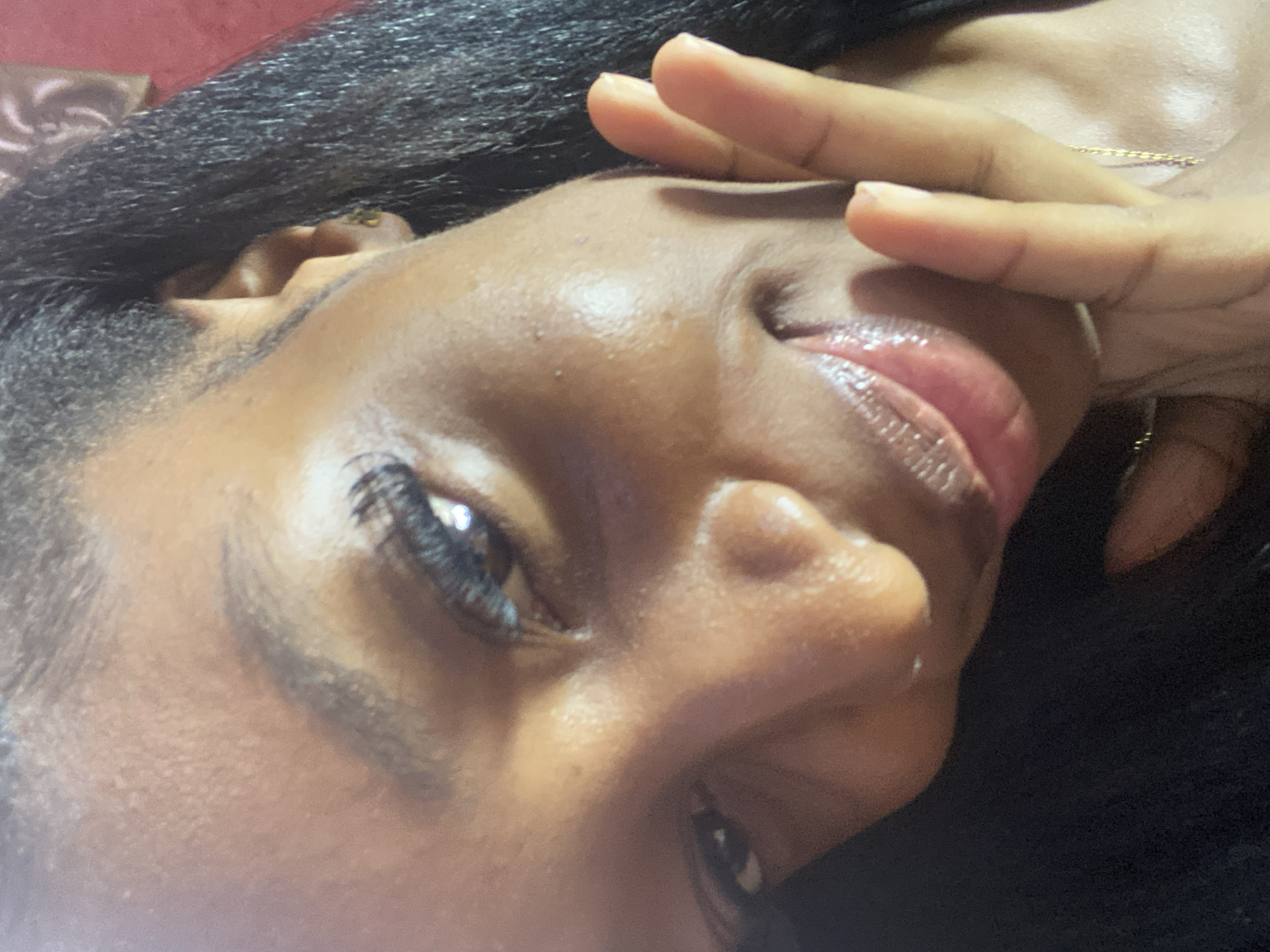 Woman takes selfies during indoor gathering in Jos, Nigeria