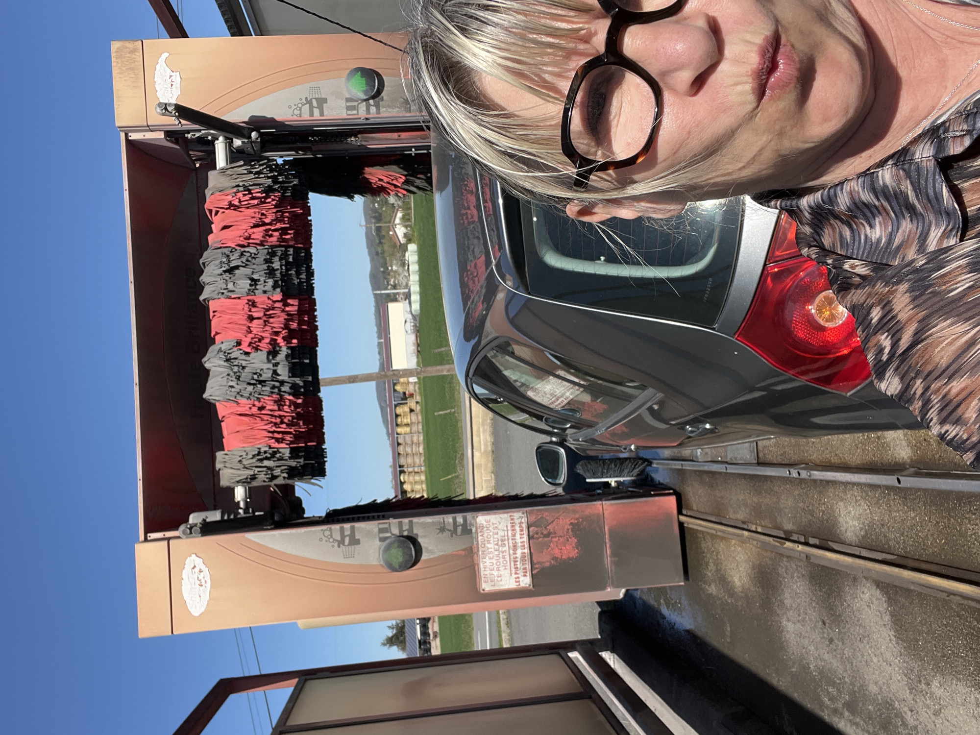Woman Takes Selfie at Car Wash in Chambœuf