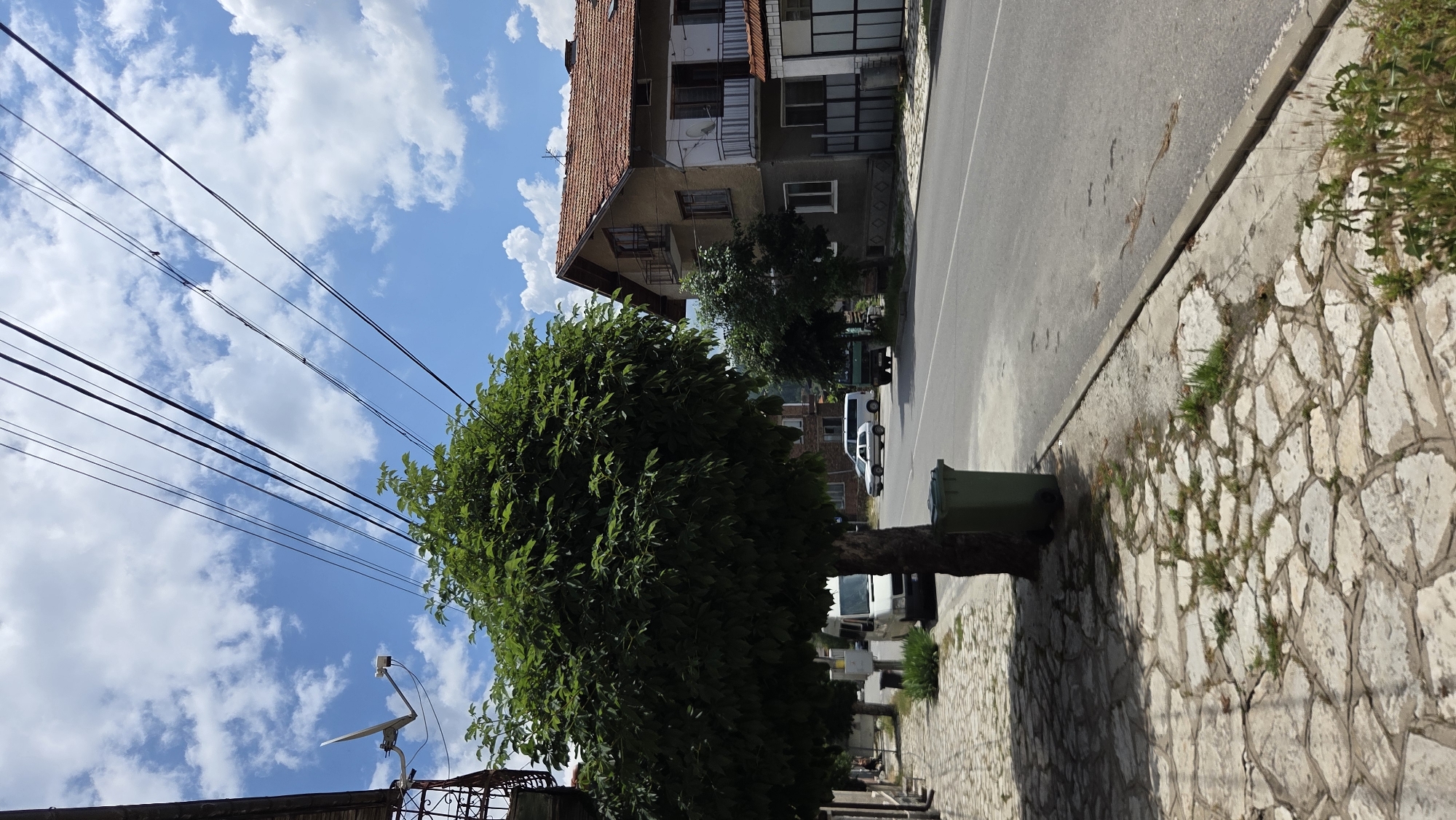 Silver VW Golf parked on a quiet street in Bania, Bulgaria