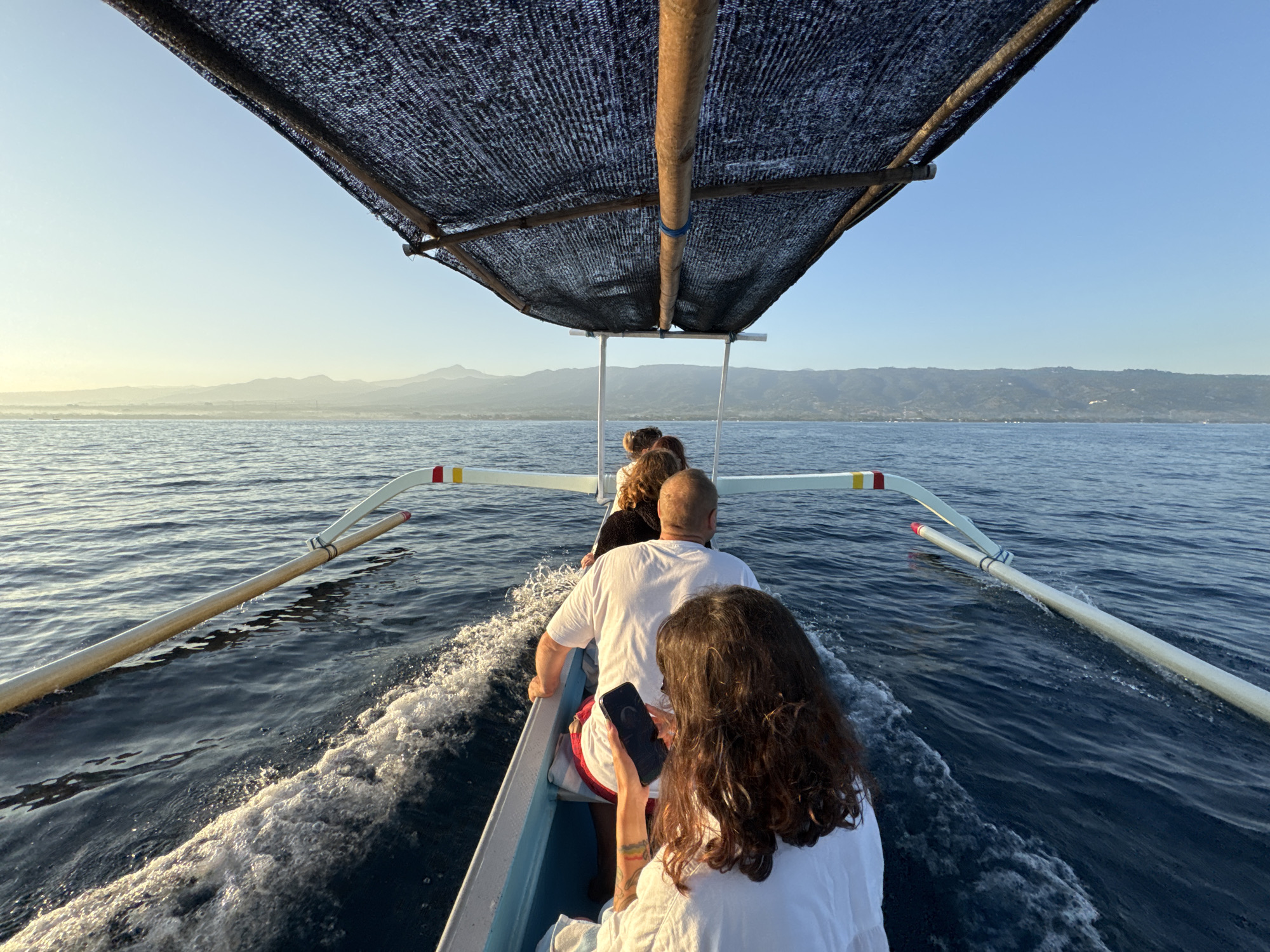 Outrigger boat ride at sunset off the Buleleng coast