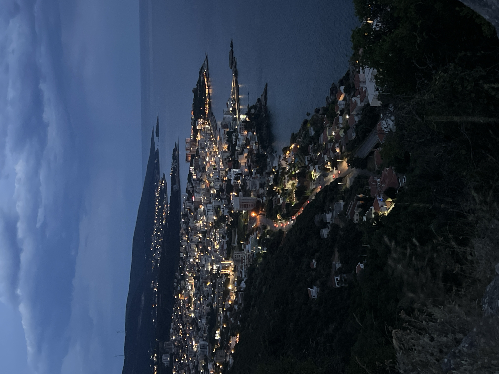 Twilight settles over Dobra Voda's coastal hillside