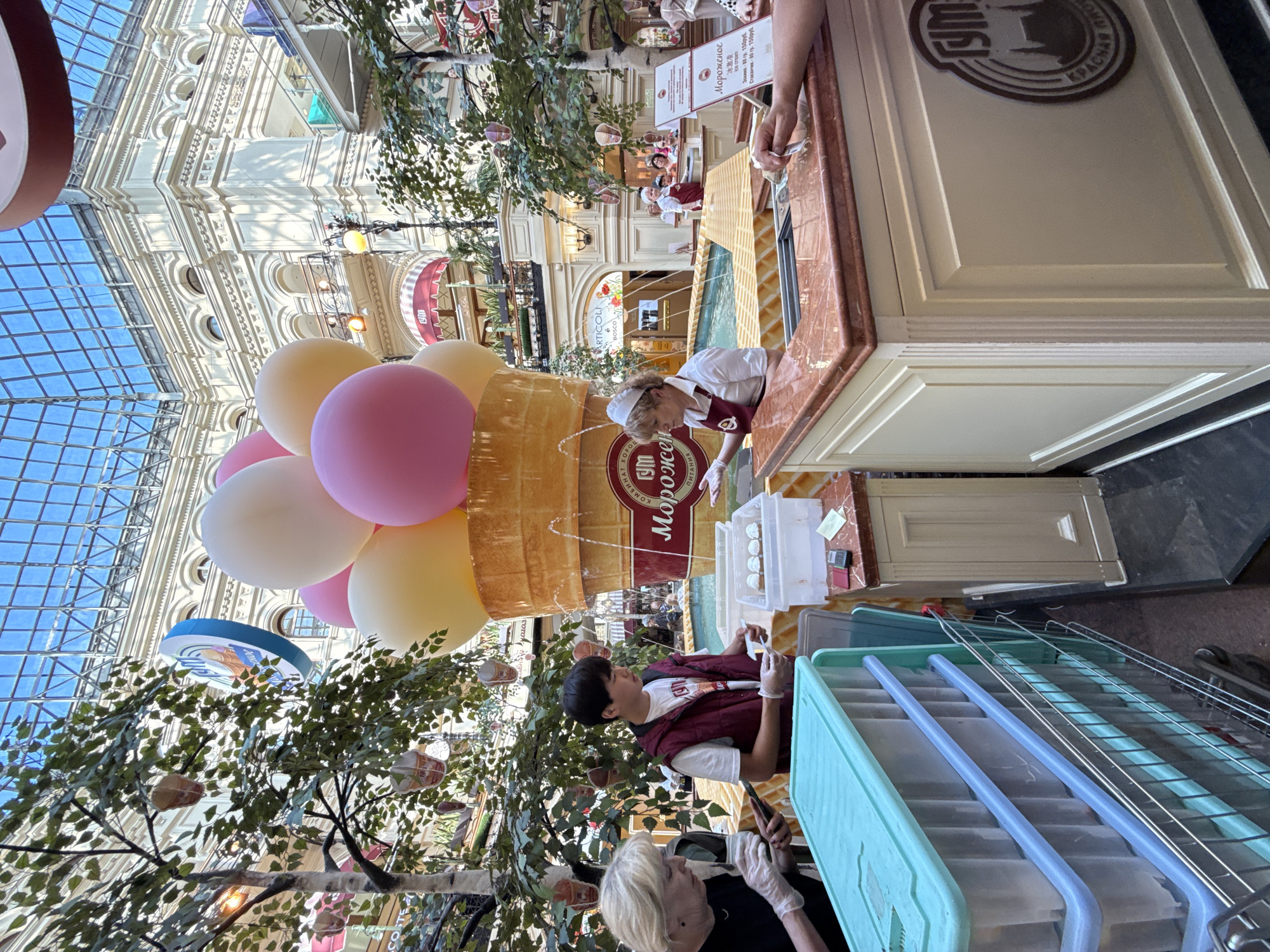 Ice cream vendor serves customers at Moscow's GUM store