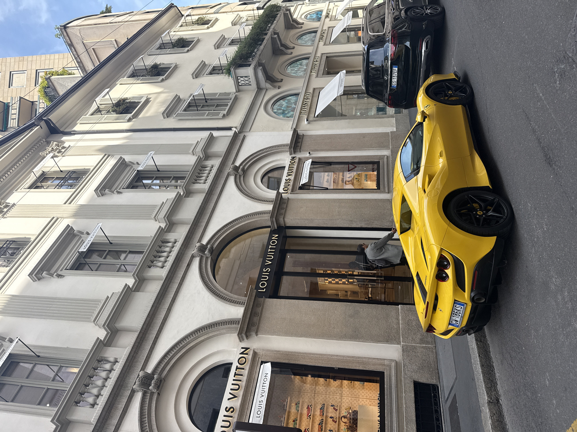 Yellow Ferrari spotted on Milan streets during sunny afternoon