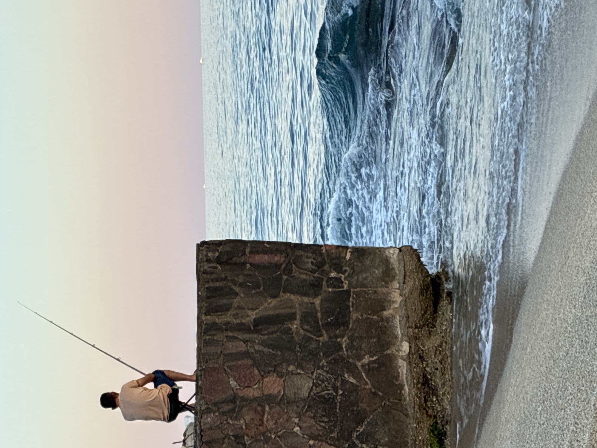 Sunset evening on the Alanya coast: beach, paddleboarding, fishing