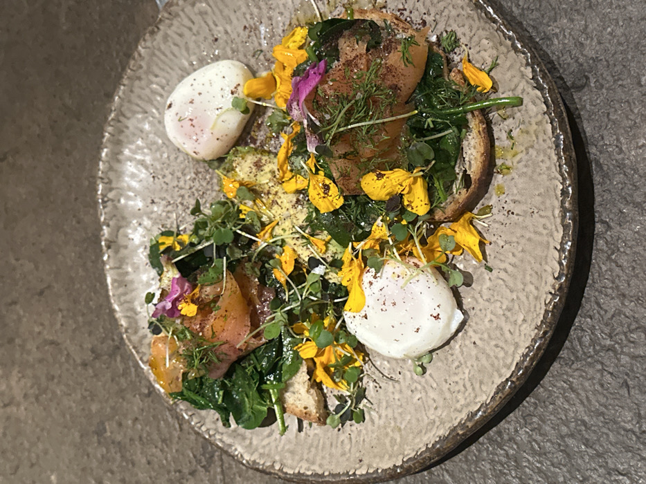 Two women share healthy meal at Madrid restaurant
