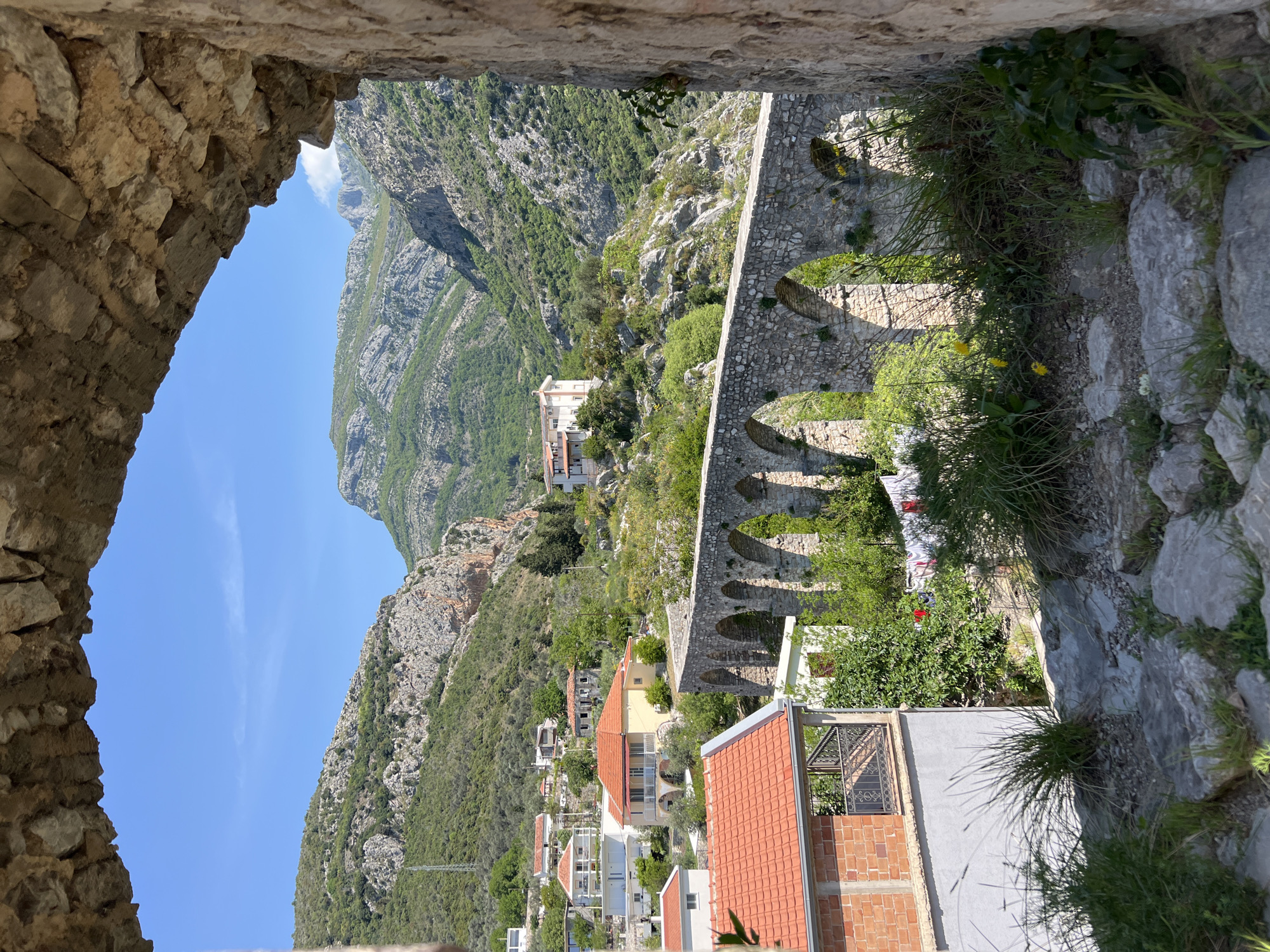 Tourist documents ancient stone ruins in Stari Bar Montenegro