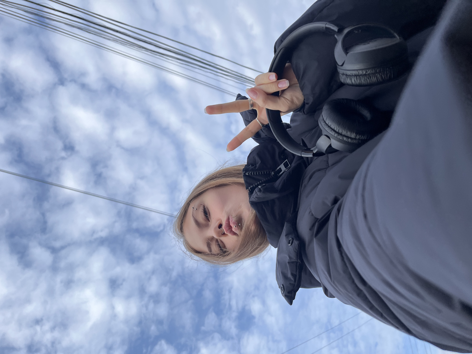 Woman photographed under cloudy skies in Foki, Russia