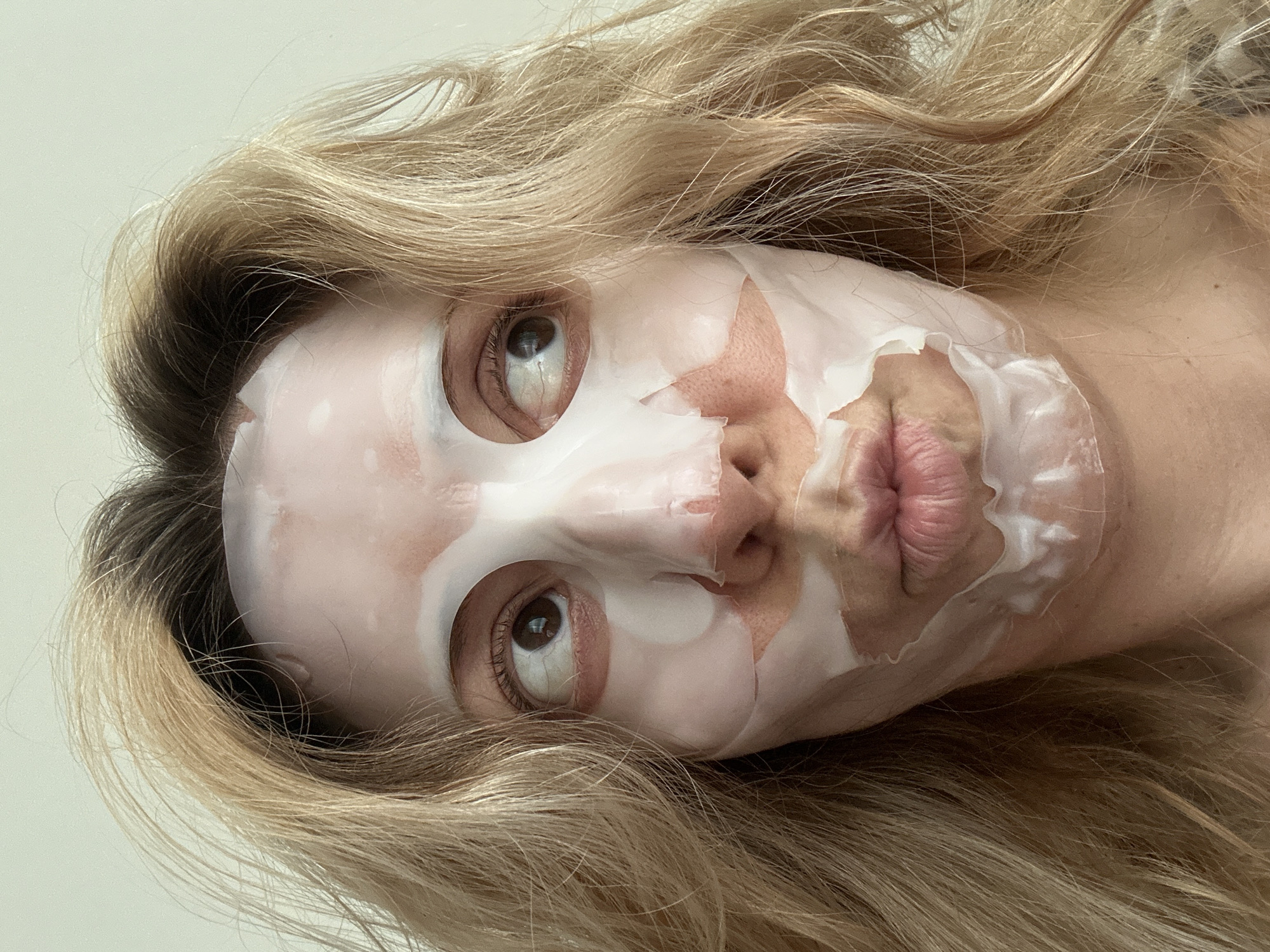 Masked blonde woman photographed in Amsterdam