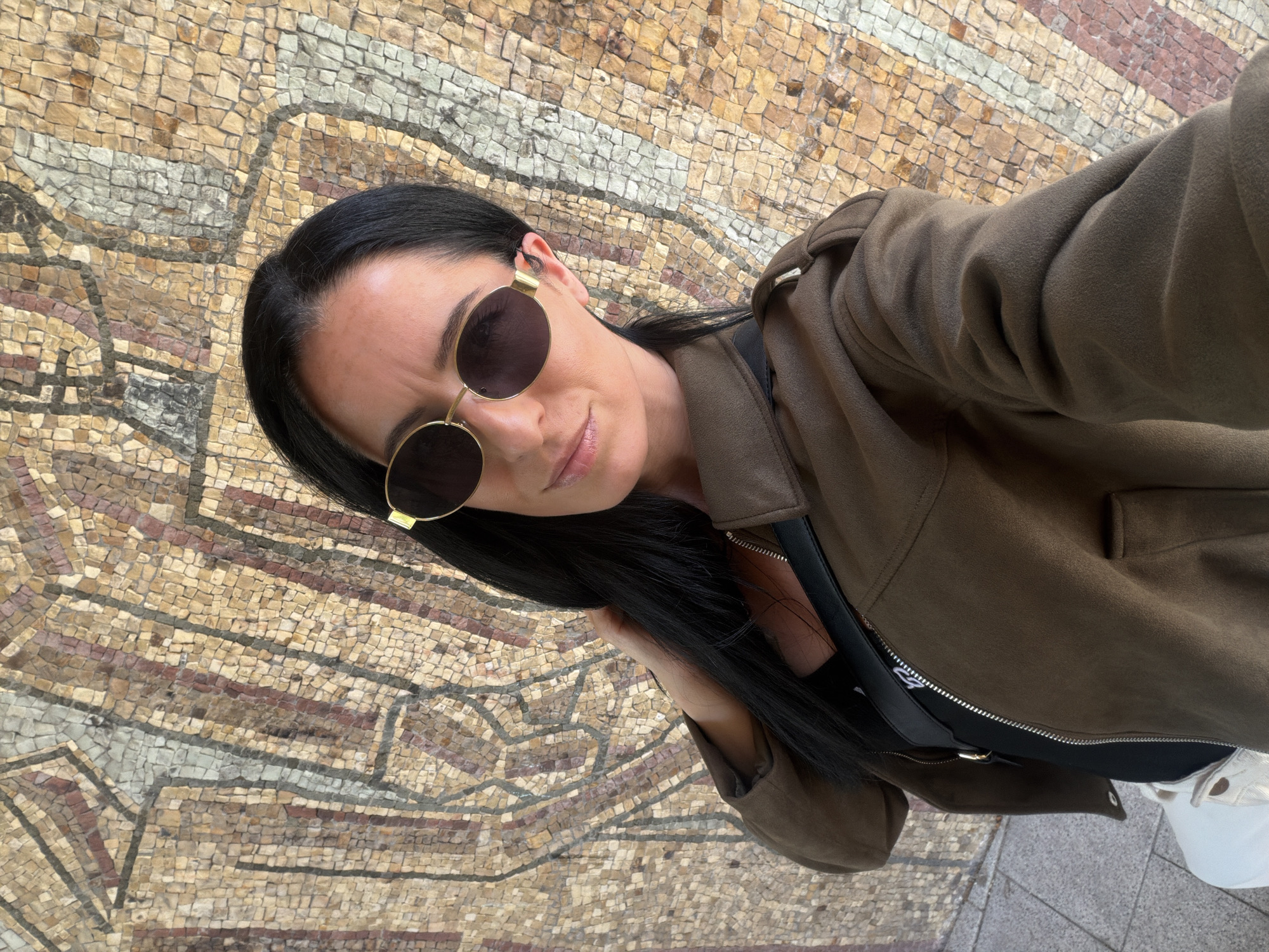 Woman photographs herself at multiple indoor locations in Pleven